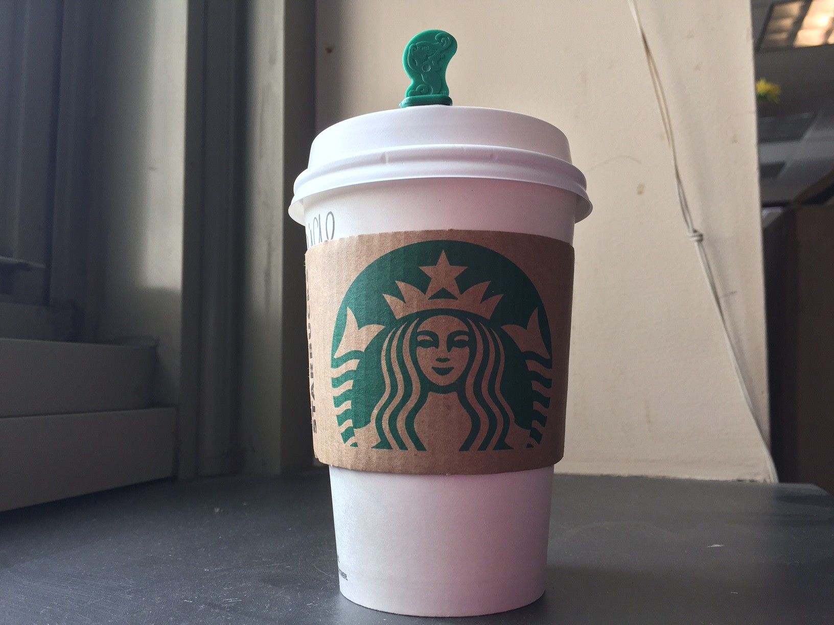 What is the name for the Starbucks green plastic sticks that plug the hole  in your cup lid and keep the coffee off of you? - Quora