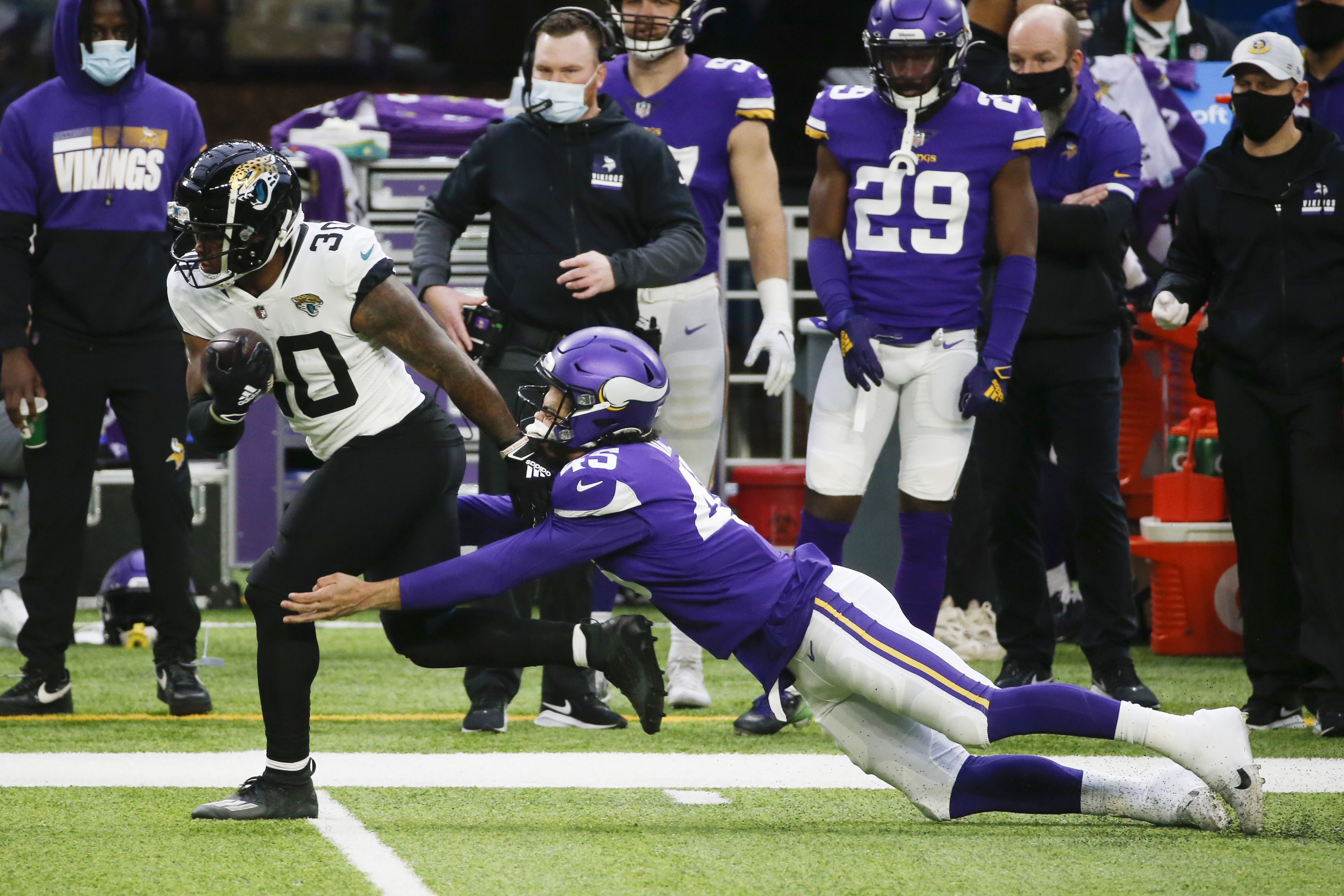 FILE - Minnesota Vikings running back Alexander Mattison (2) breaks a  tackle to score a touchdown in the first quarter of an NFL match between  Minnesota Vikings and New Orleans Saints at