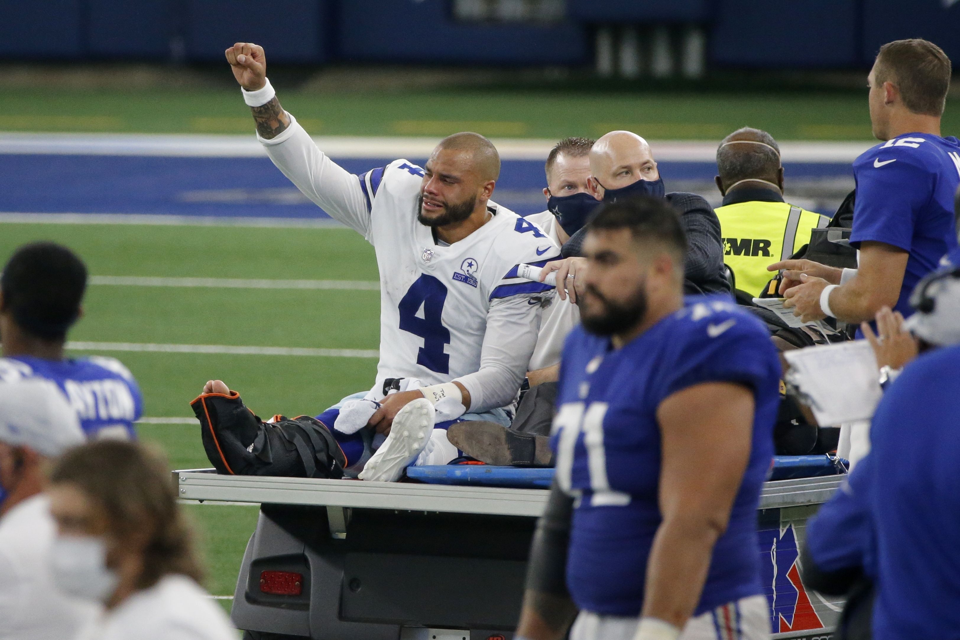 Dallas Cowboys quarterback Dak Prescott (4) hands off to running