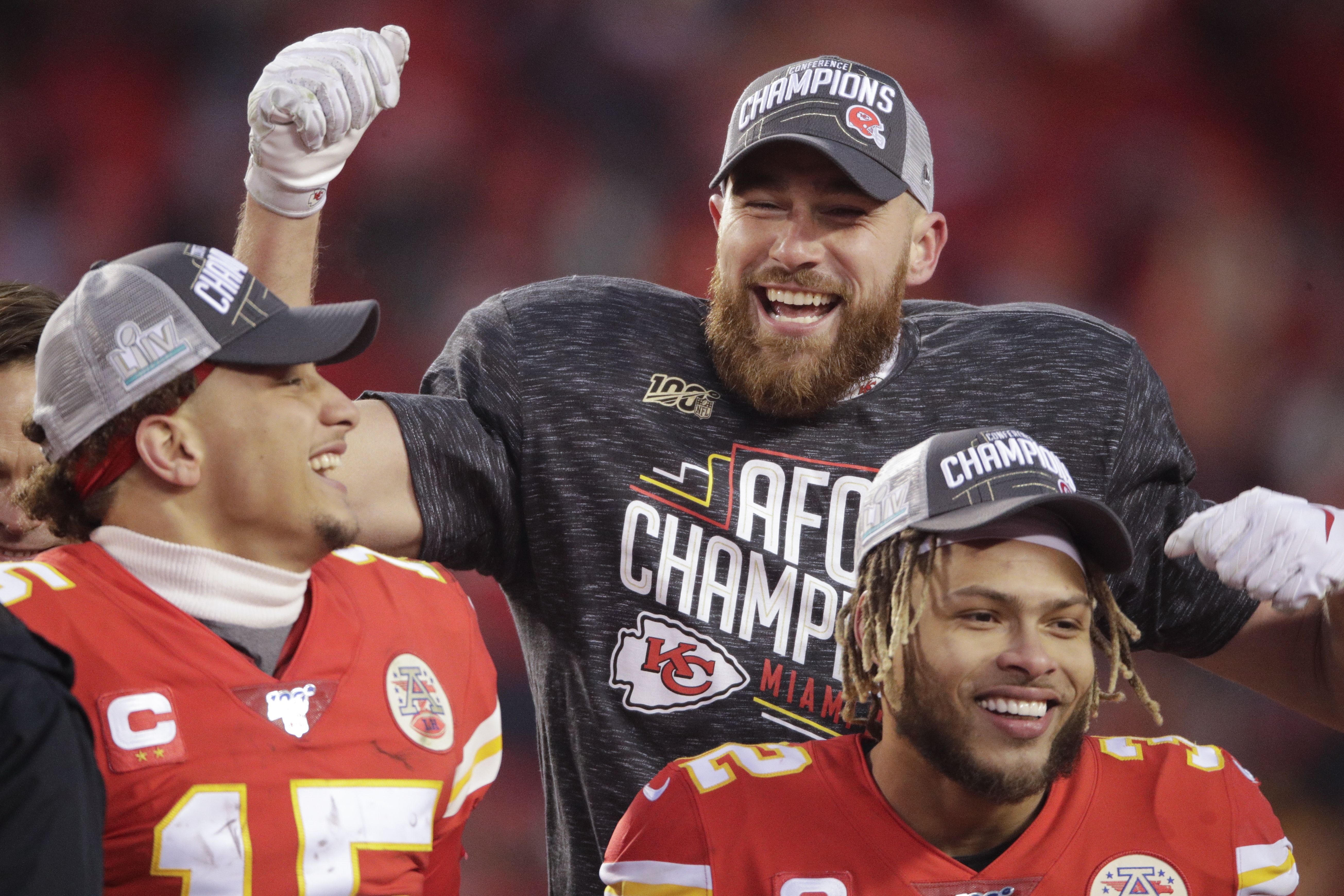 Kansas City Chiefs tight end Travis Kelce (87) holds the Lamar Hunt trophy  after the AFC Championship against the Tennessee Titans, Sunday, Jan 19,  2020, in Kansas City, Mo. The Chiefs beat