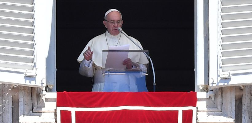 Pope Francis addresses the crowd from the window of the apostolic pal