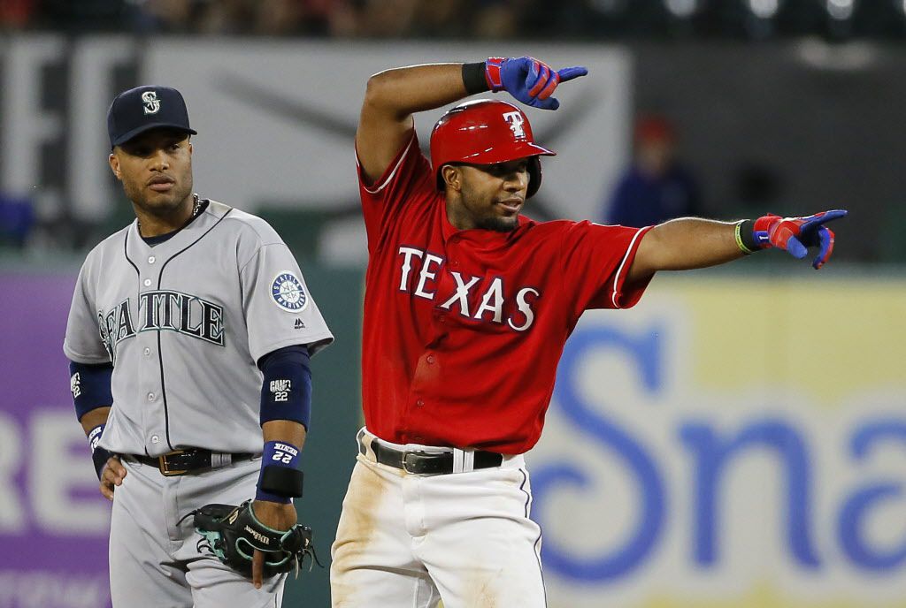 Texas Rangers shortstop Elvis Andrus, left, gets a word from Texas