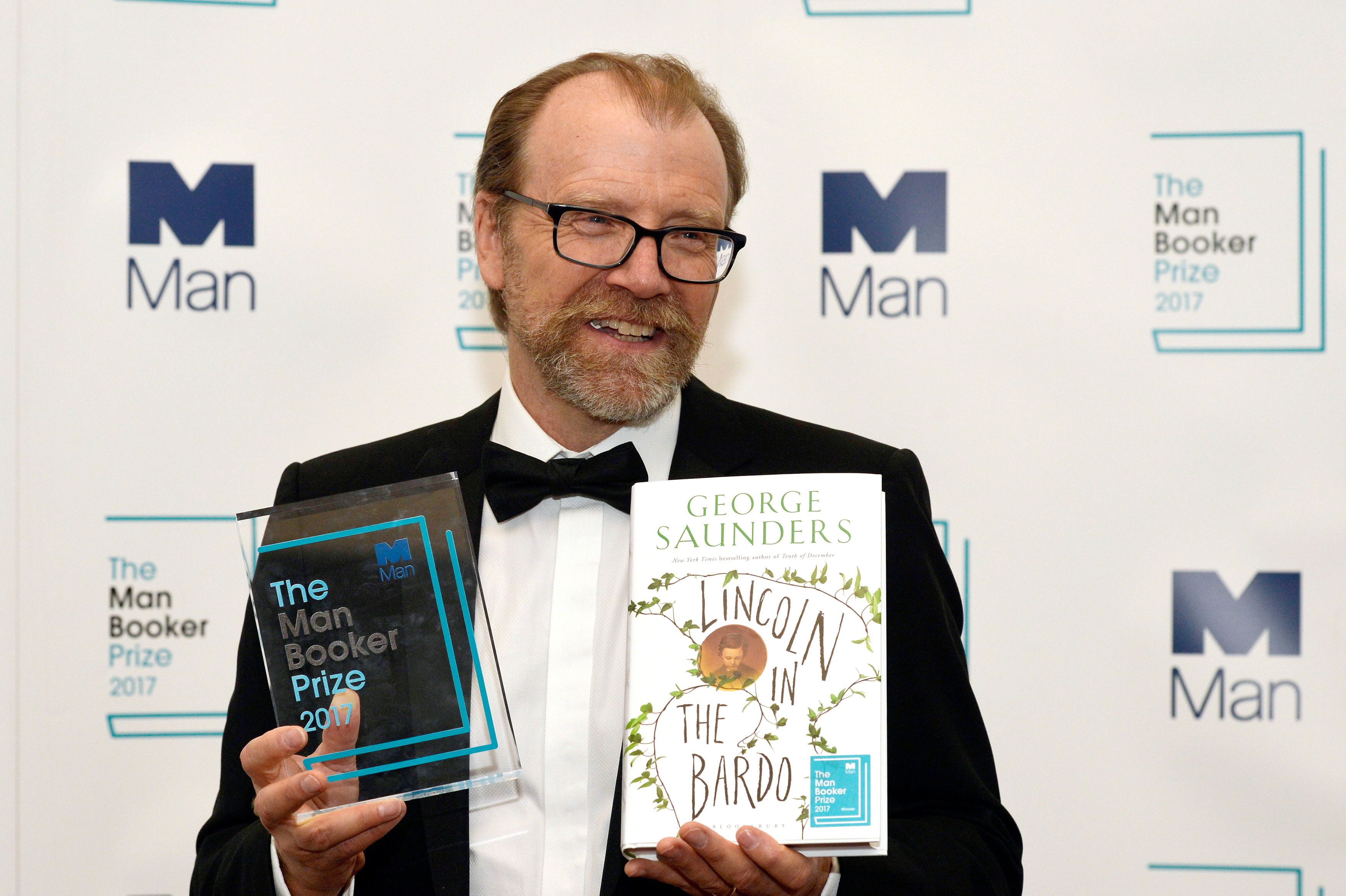 George Saunders, author of 'Lincoln in the Bardo', poses for photographers after winning the Man Booker Prize for Fiction 2017 in London