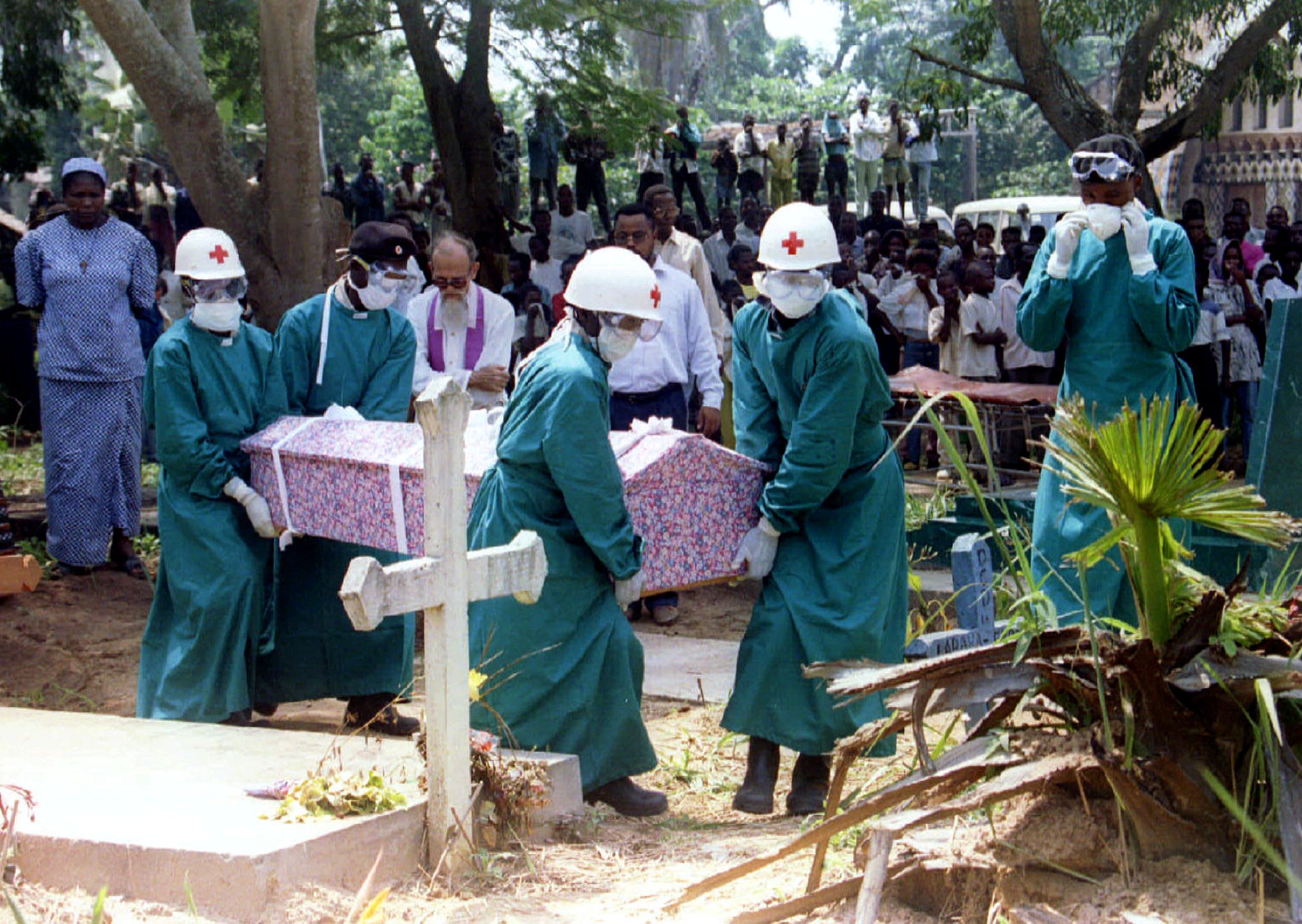 Hospital staff carry a coffin containing the body of Dinarosa Belleri, the fifth Italian nun from th..