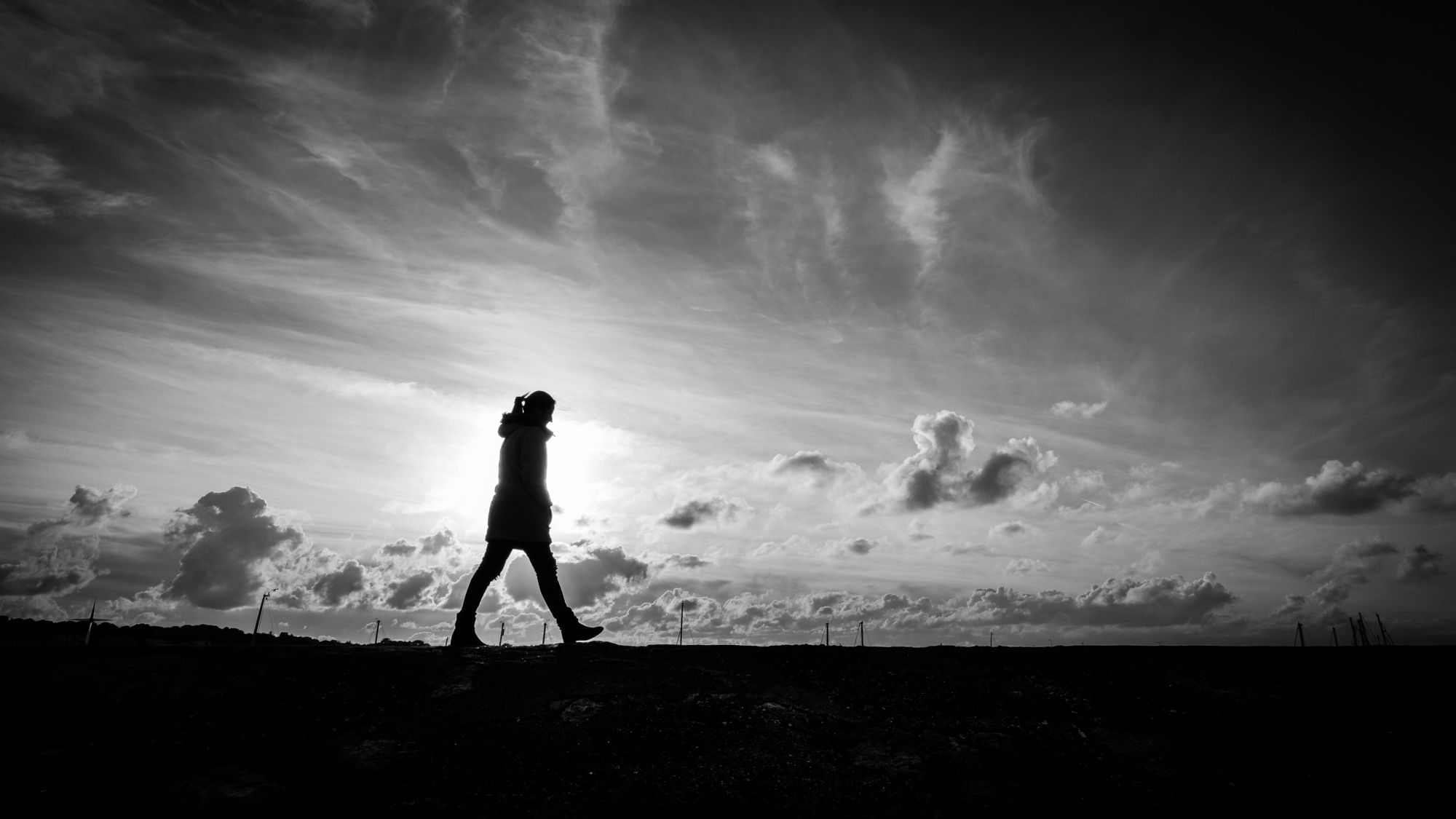 Walking alone - Howth, Ireland - Black and white street photogra