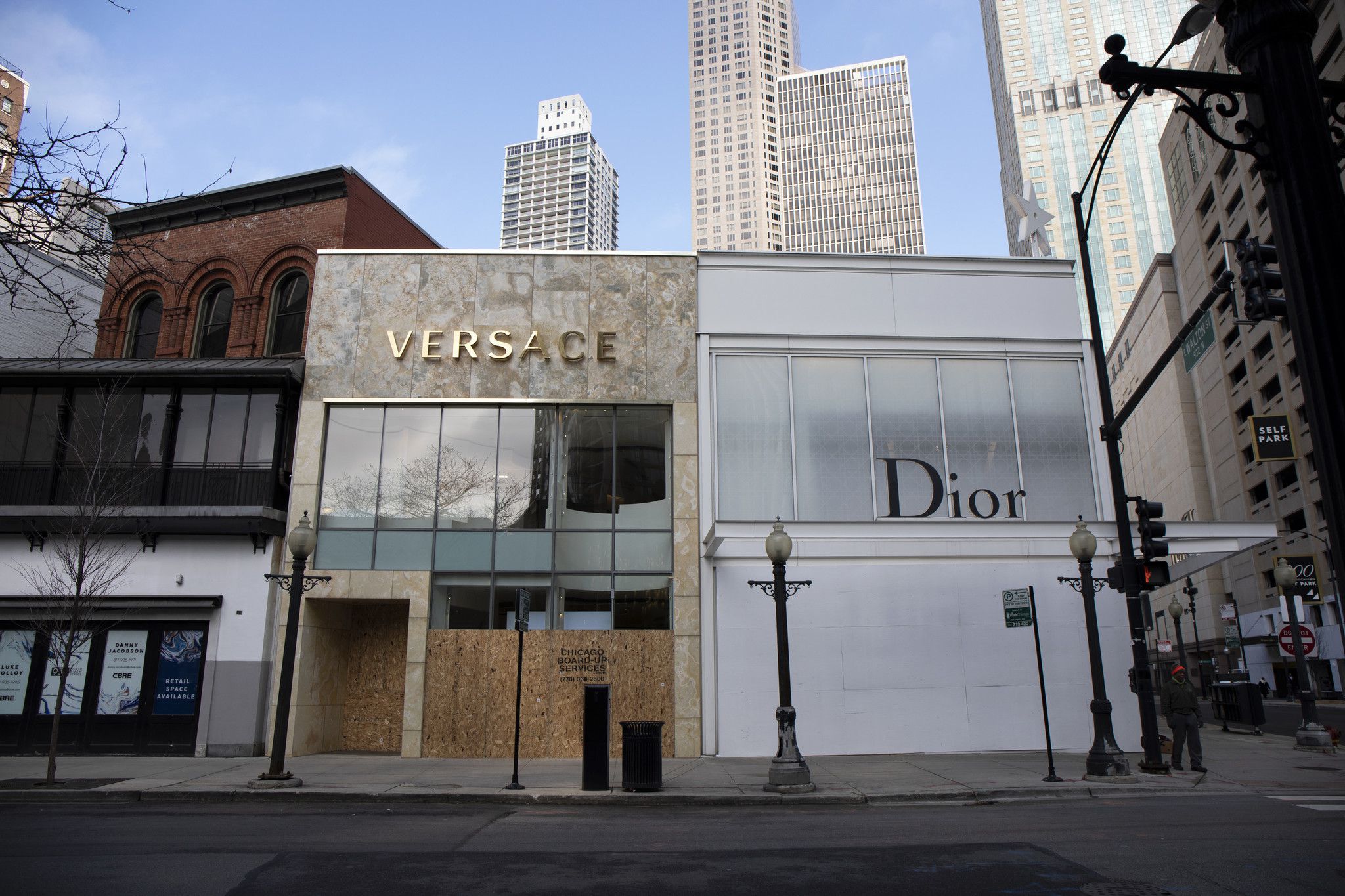 Empty windows, boarded-up storefronts dot the Magnificent Mile during  coronavirus shutdown