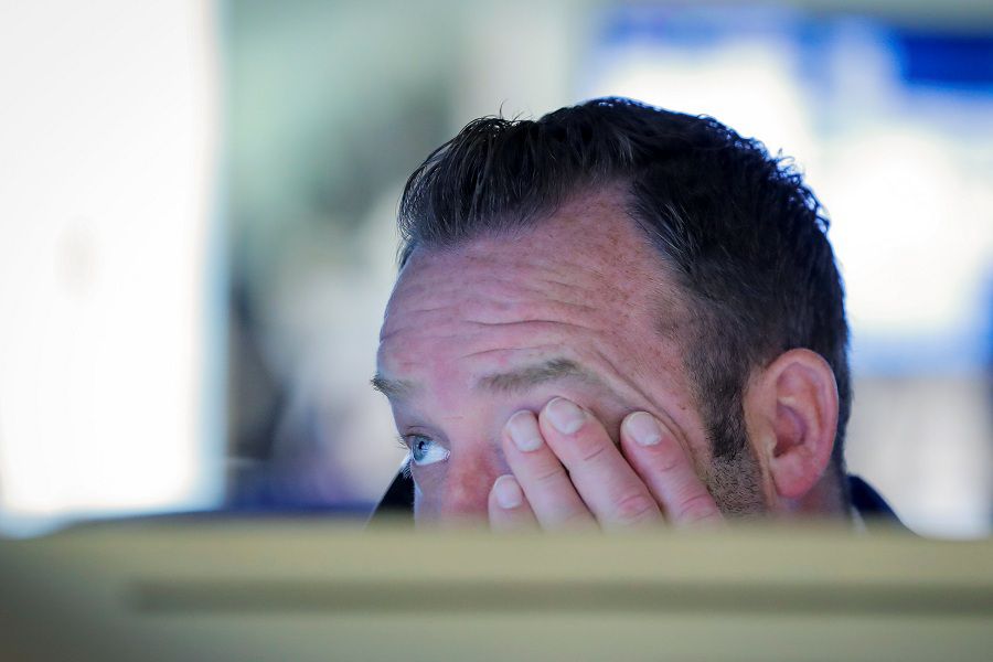 Traders work on the floor of the NYSE in New York