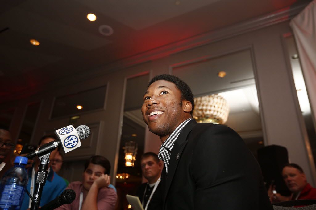 Watch this adorable young fan give A&M's Myles Garrett a dinosaur T-shirt