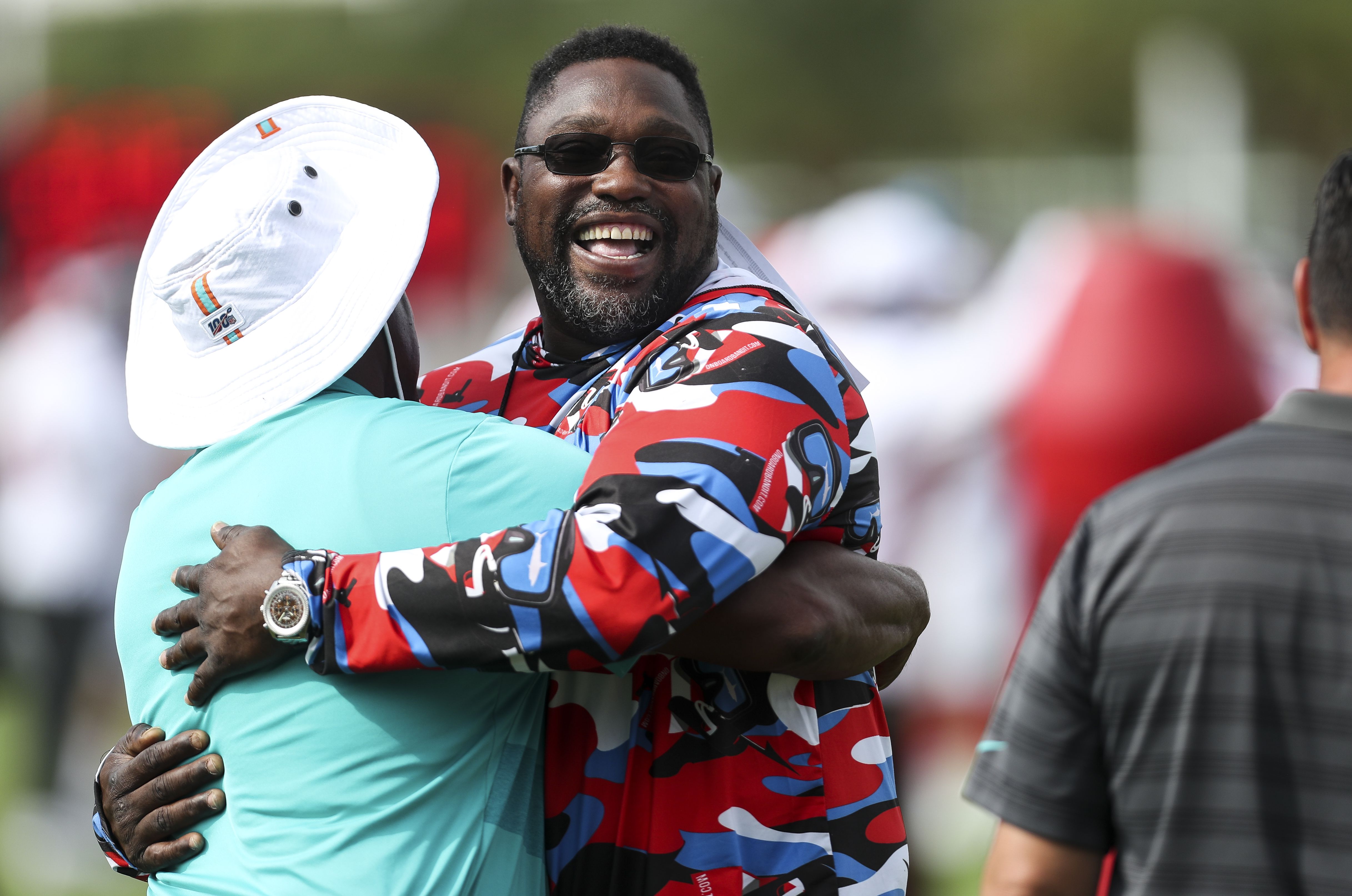 Tampa Bay Buccaneers' Warren Sapp reacts after he intercepted a pass and  pitched it to teammate Derrick Brooks who ran it in for a touchdown in the  fourth quarter of their 20-6