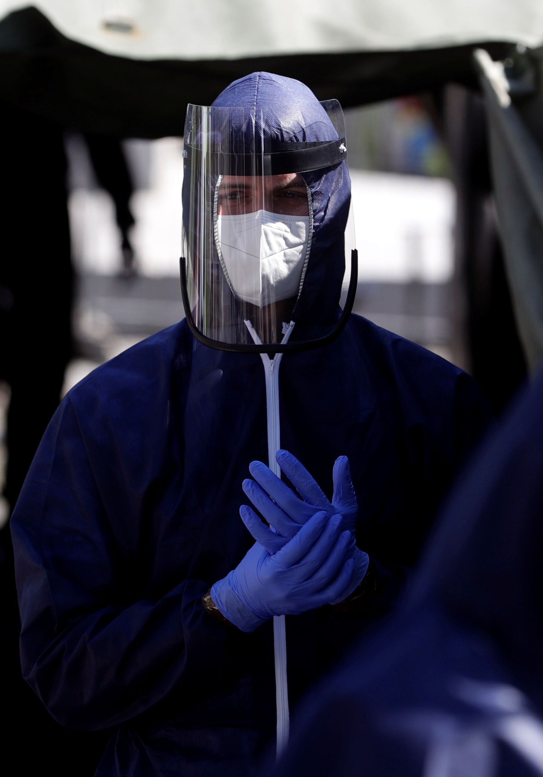 Medical workers get ready to test people for the coronavirus disease in Prgaue