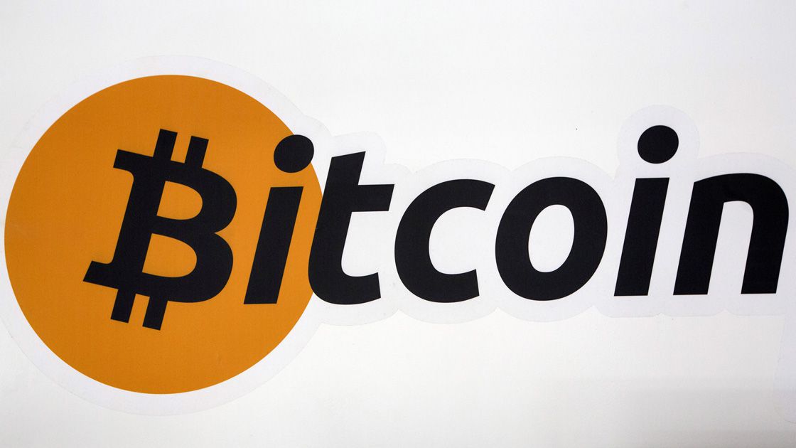 FILE PHOTO: A Bitcoin logo is displayed at the Bitcoin Center New York City in New York's financial district