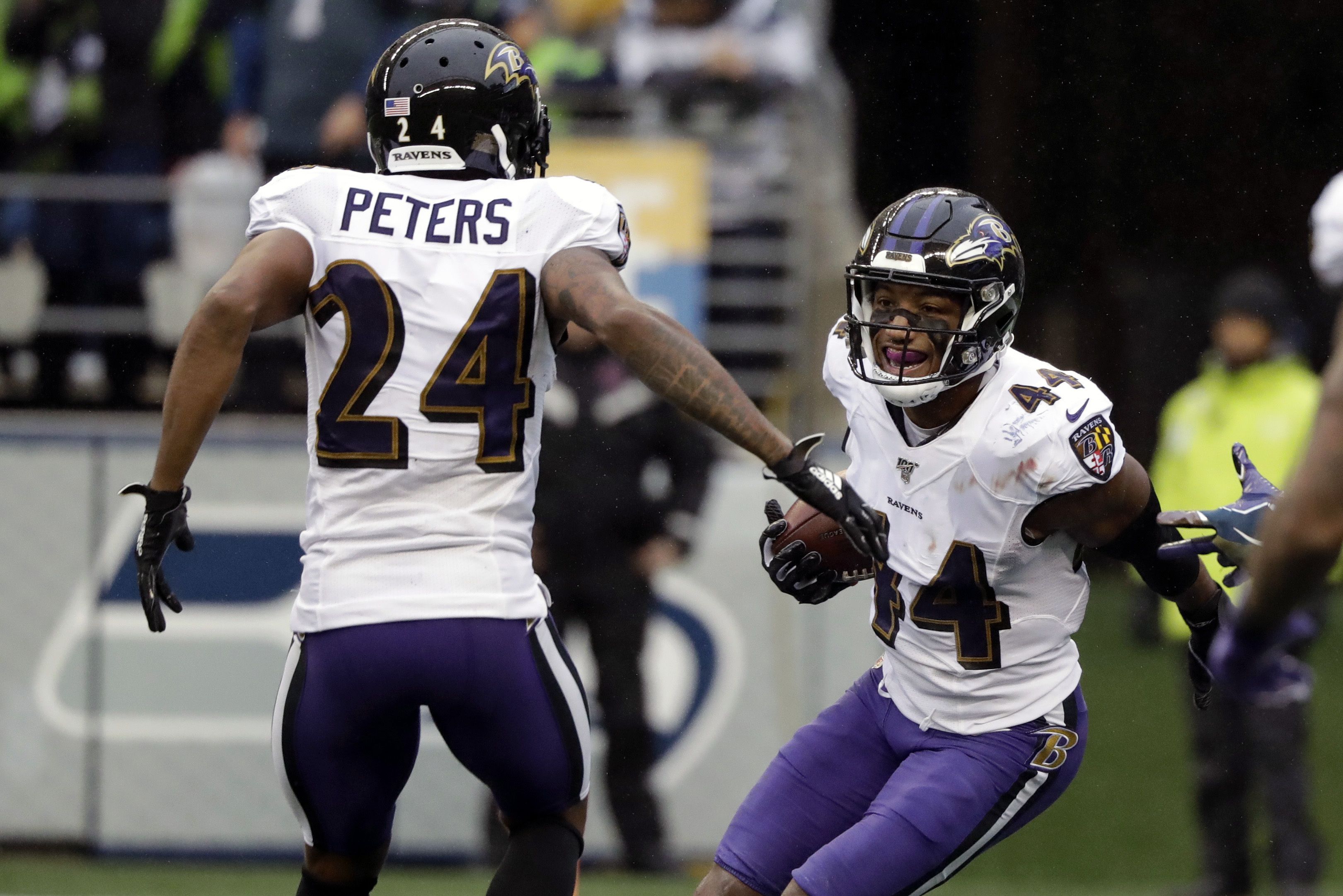 Marcus Peters gets No. 24 jersey from Brandon Carr