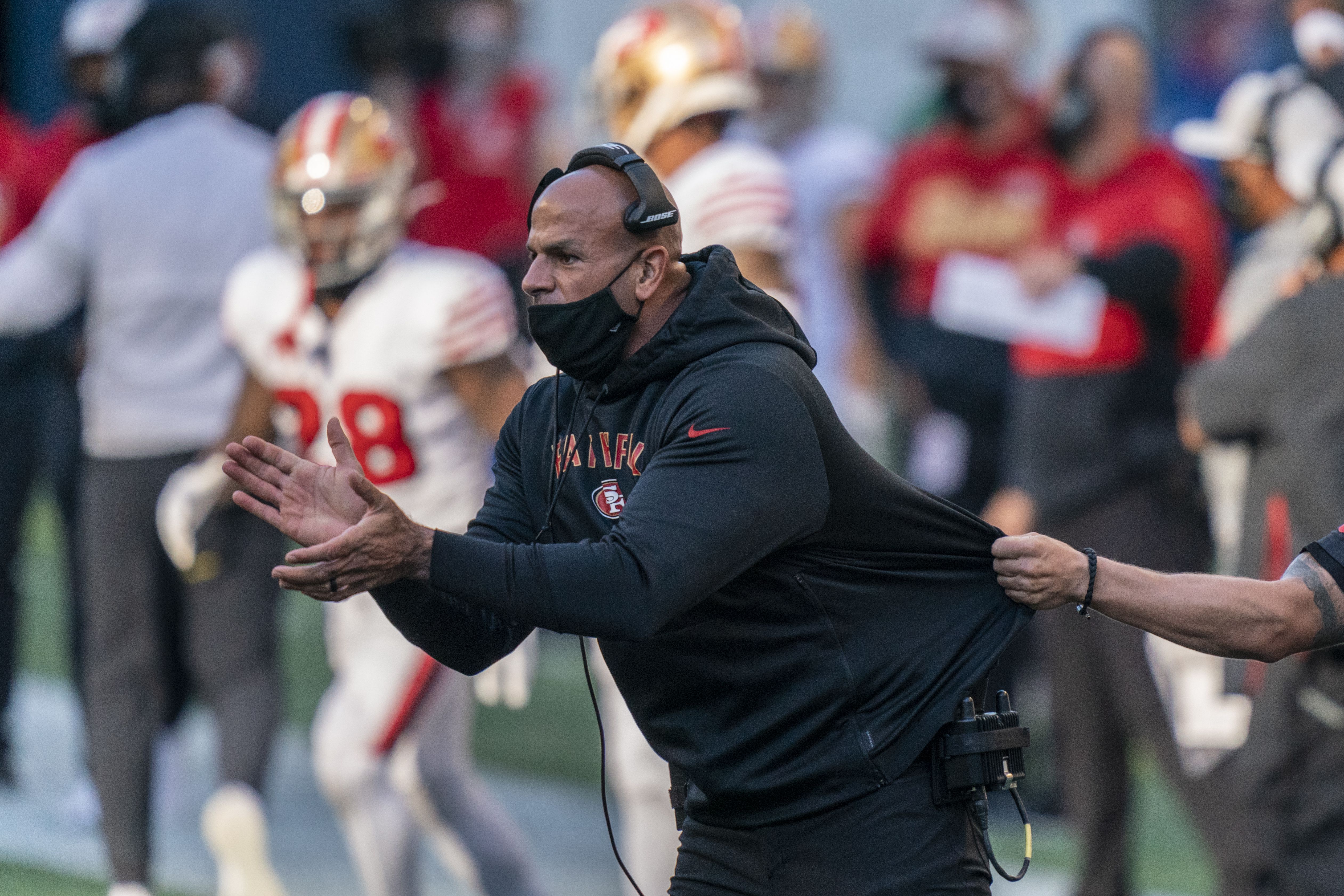 New York Jets head coach Robert Saleh watches a replay on screen