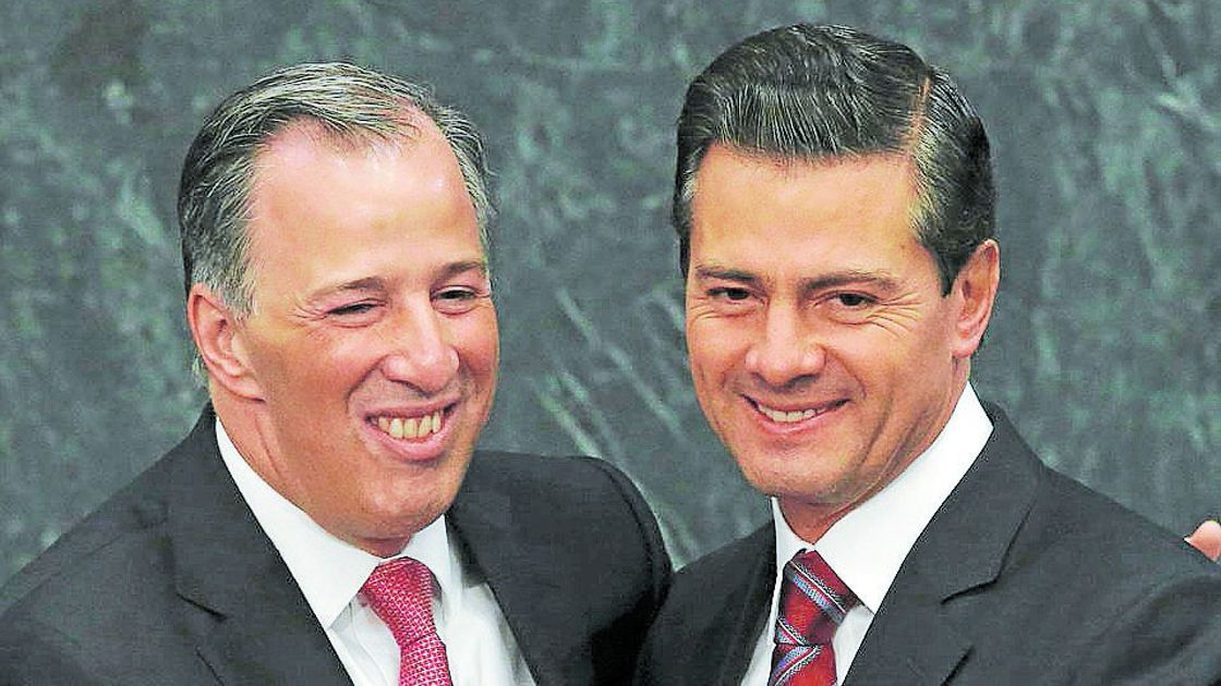 Mexican President Nieto embraces Finance Minister Meade during an event at Los Pinos presidential residence in Mexico