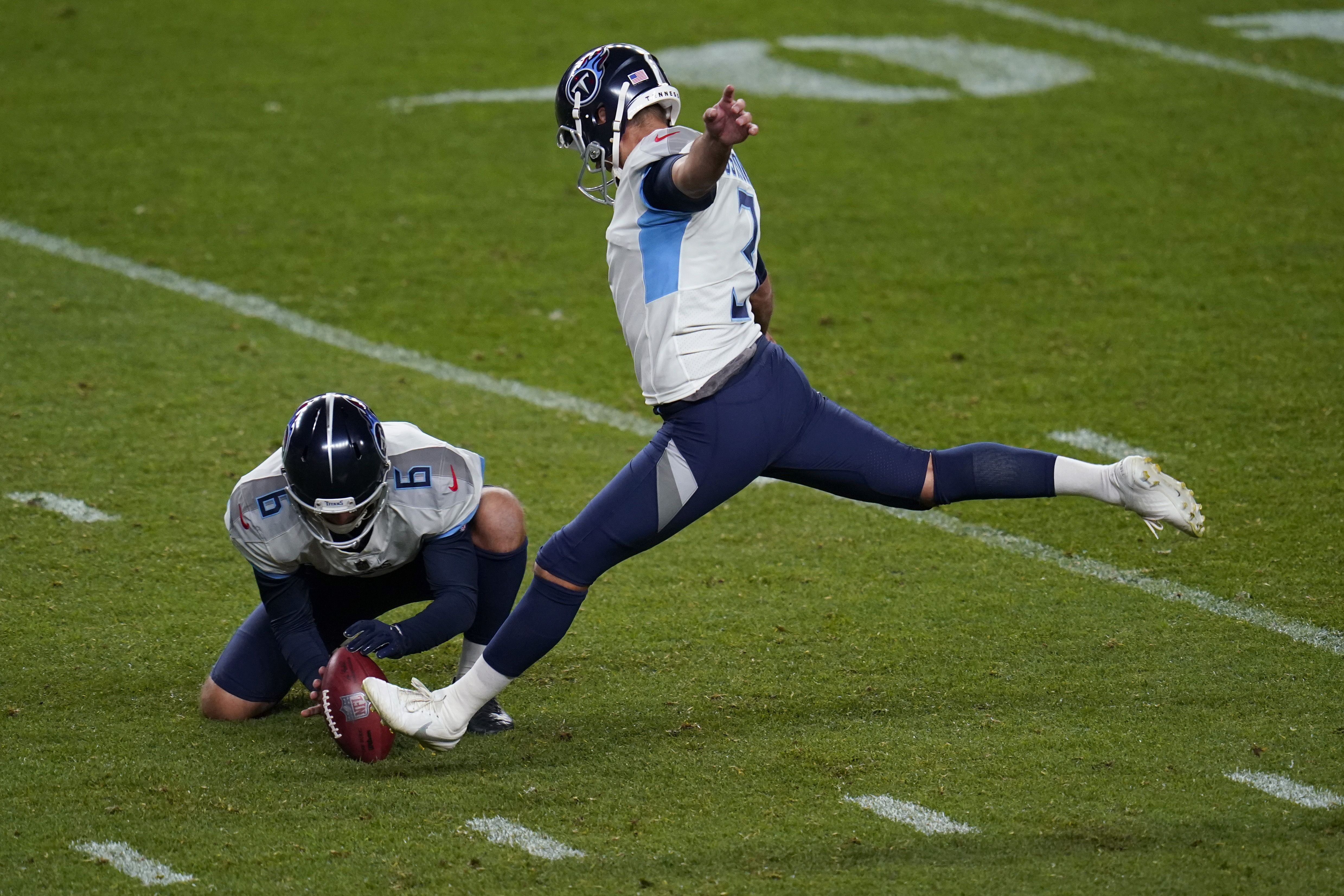 Tennessee Titans punter Brett Kern (6) kicks the ball against the