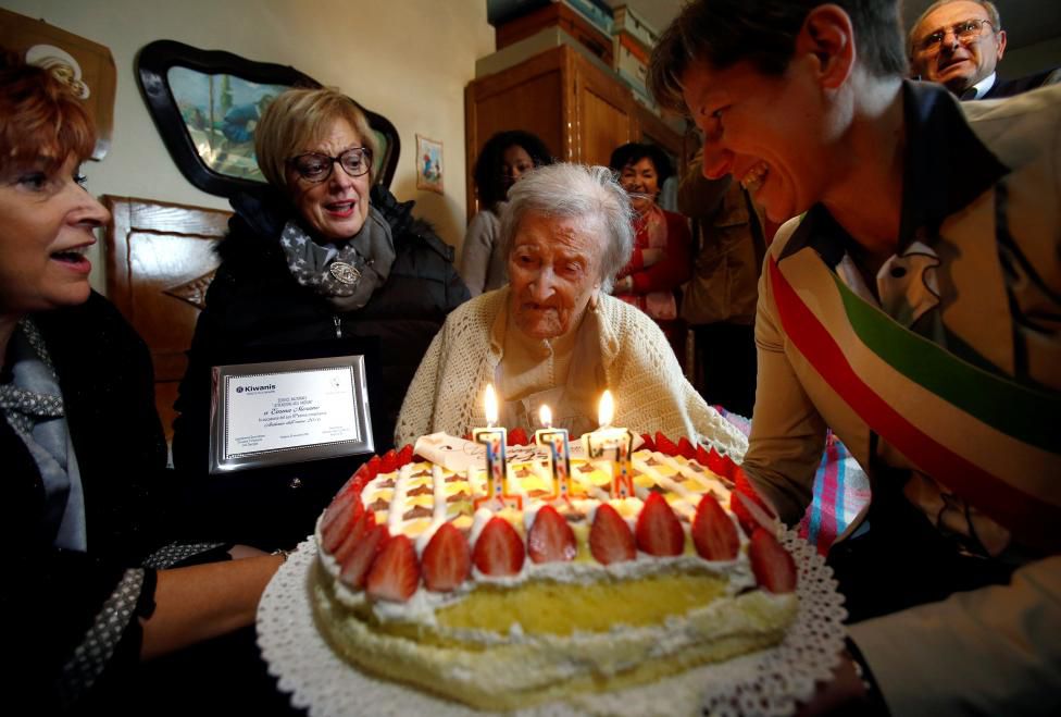 Emma Morano, thought to be the world's oldest person and the last to be born in the 1800s, reacts in front of her 117th birthday cake in Verbania