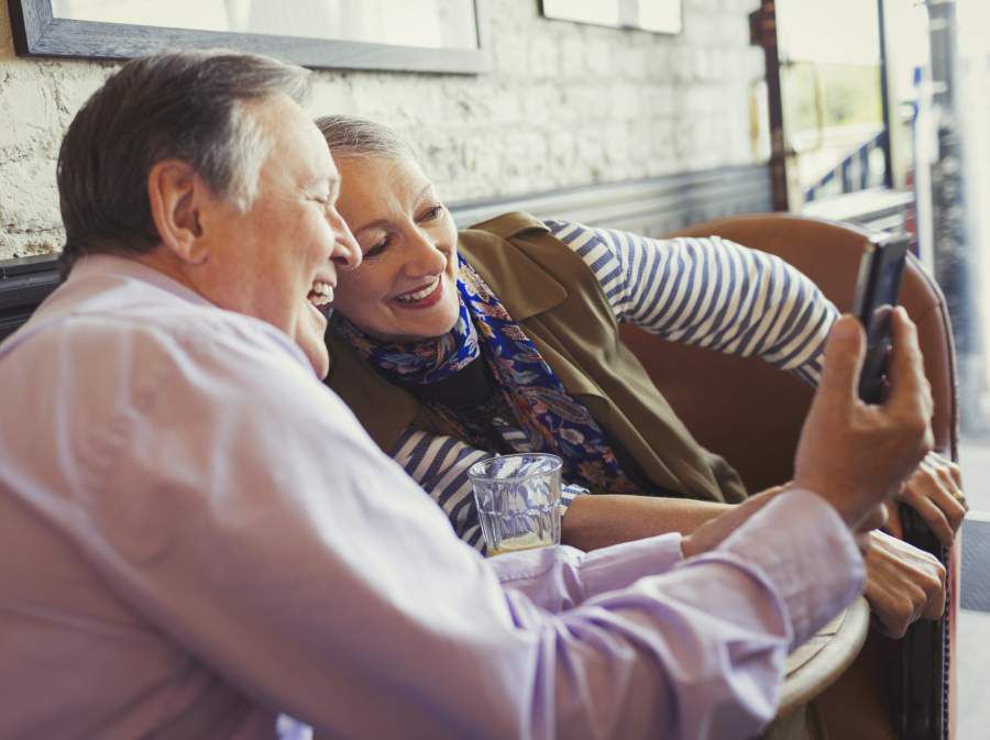 Smiling senior couple taking selfie