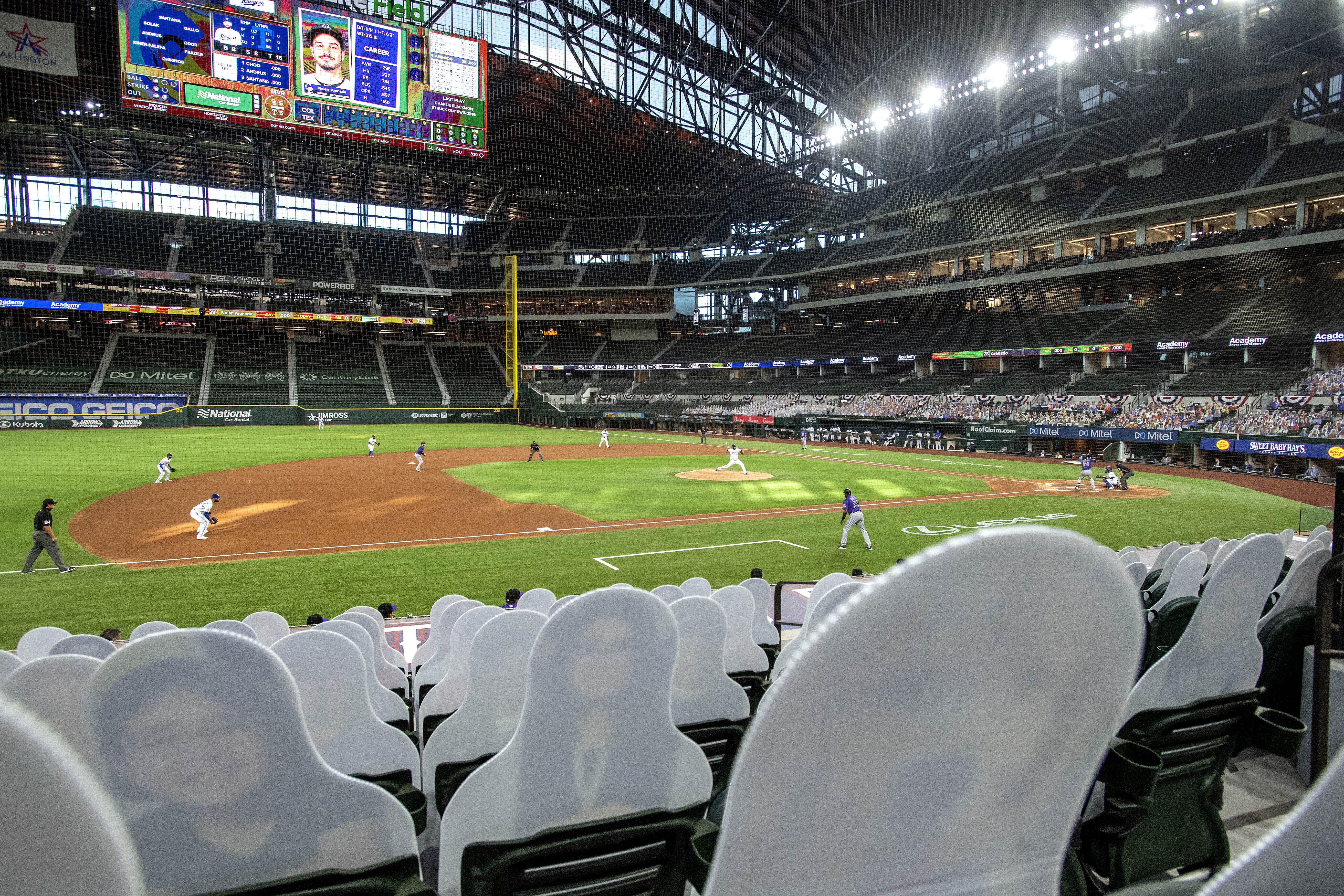 Empty stands, masked players as baseball returns