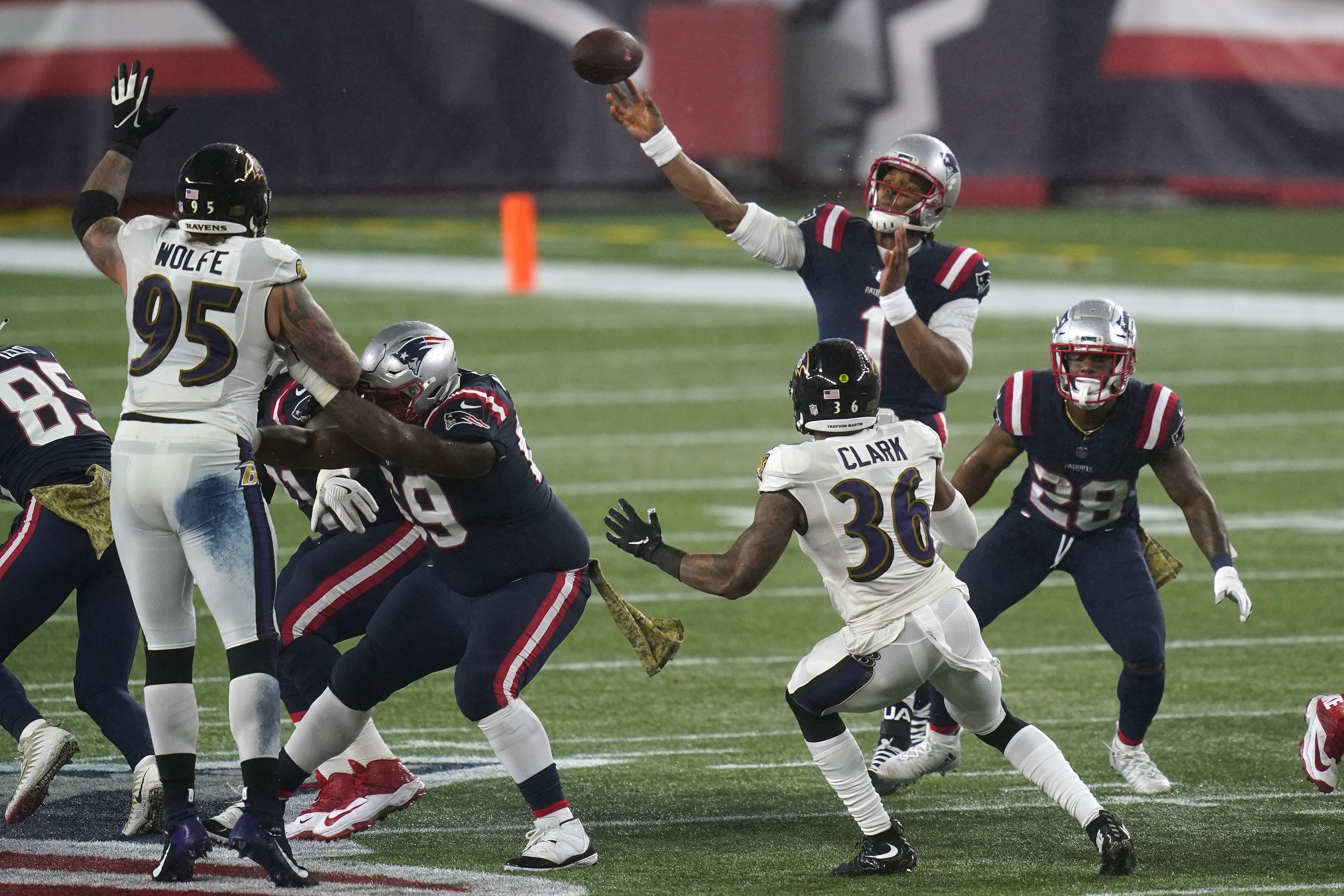 Cam Newton helps Patriots beat Ravens in rain and wind