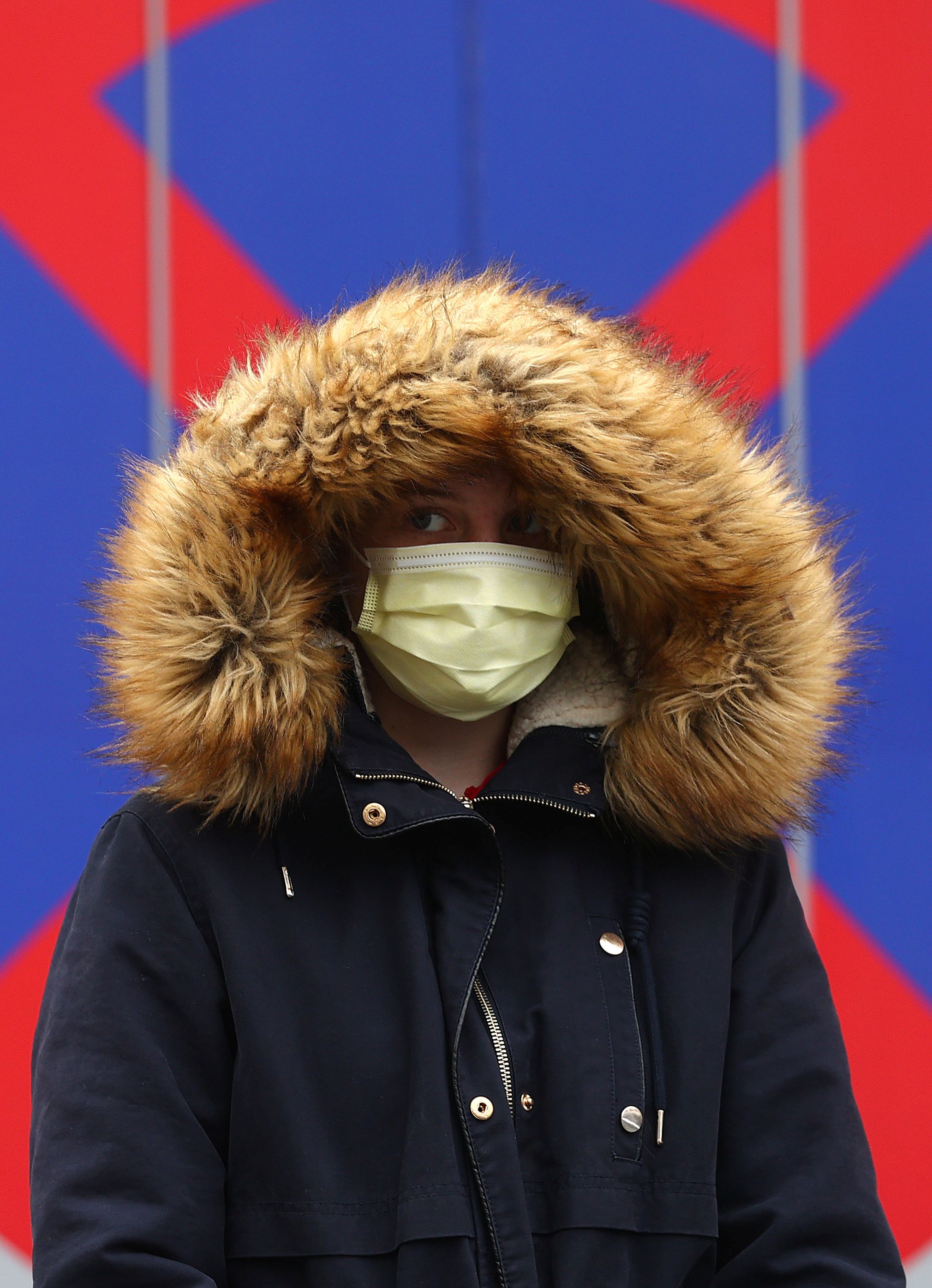 People queue outside a coronavirus (COVID-19) test center in Frankfurt