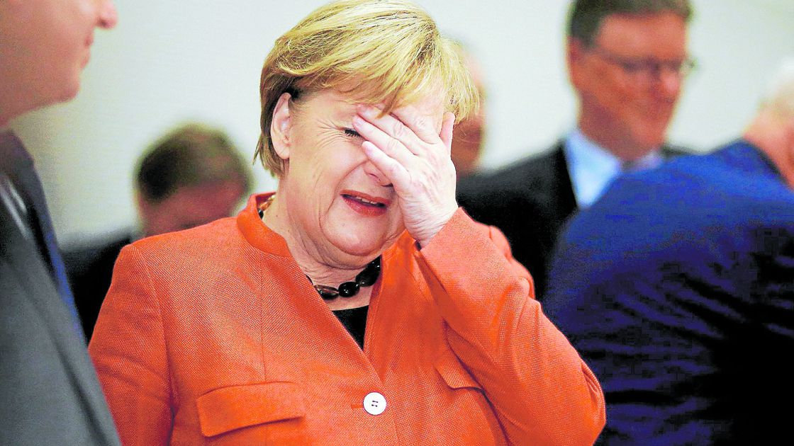 German Chancellor Merkel attends a meeting of the CDU/CSU parliamentary group at the Bundestag in Berlin