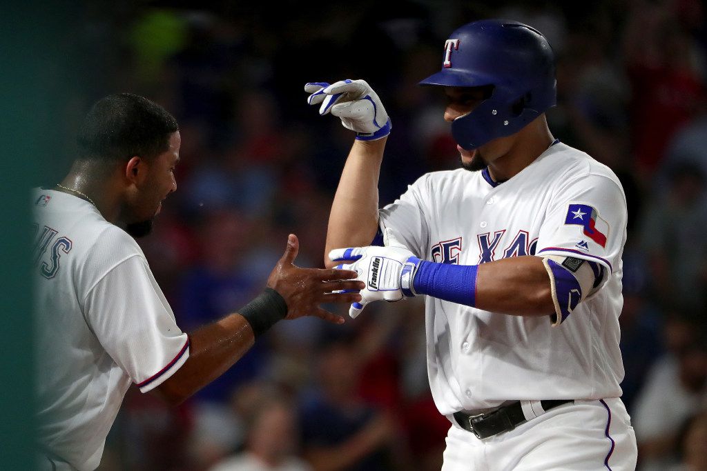 Adrian Beltre, Elvis Andrus, and Nomar Mazara by Tom Pennington