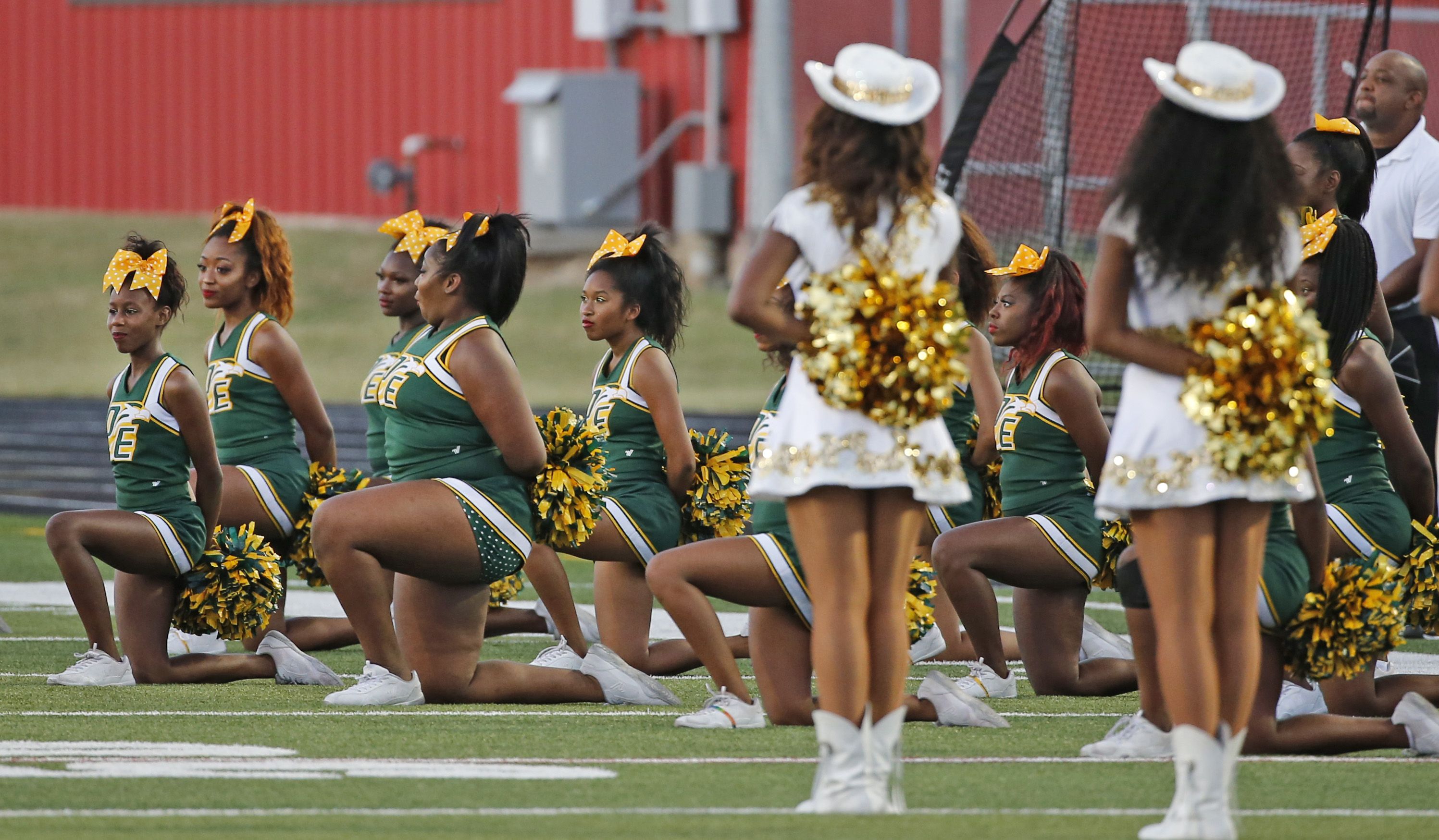 NFL cheerleader takes a knee during national anthem, News