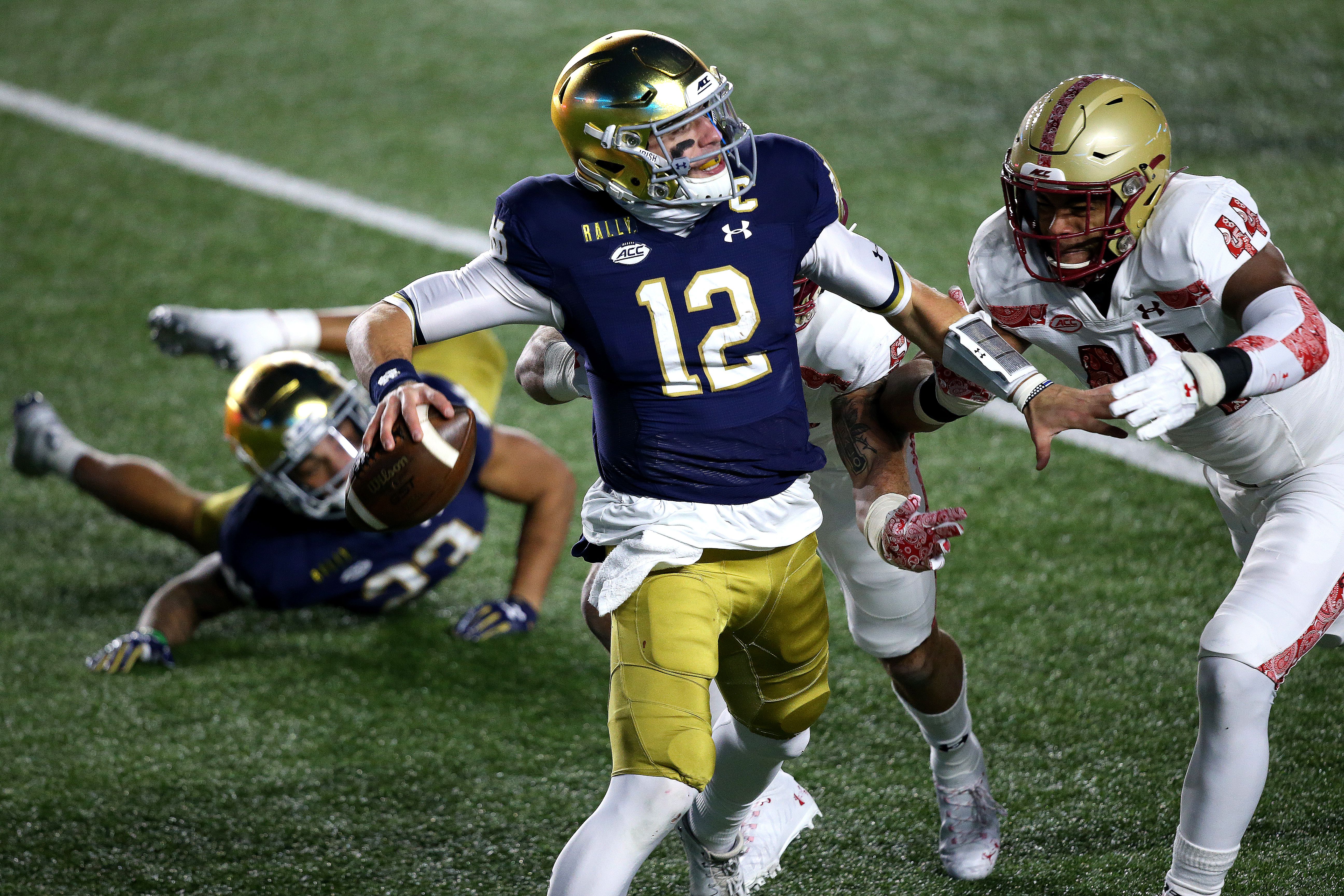 Ian Book of the Notre Dame Fighting Irish runs for a touchdown