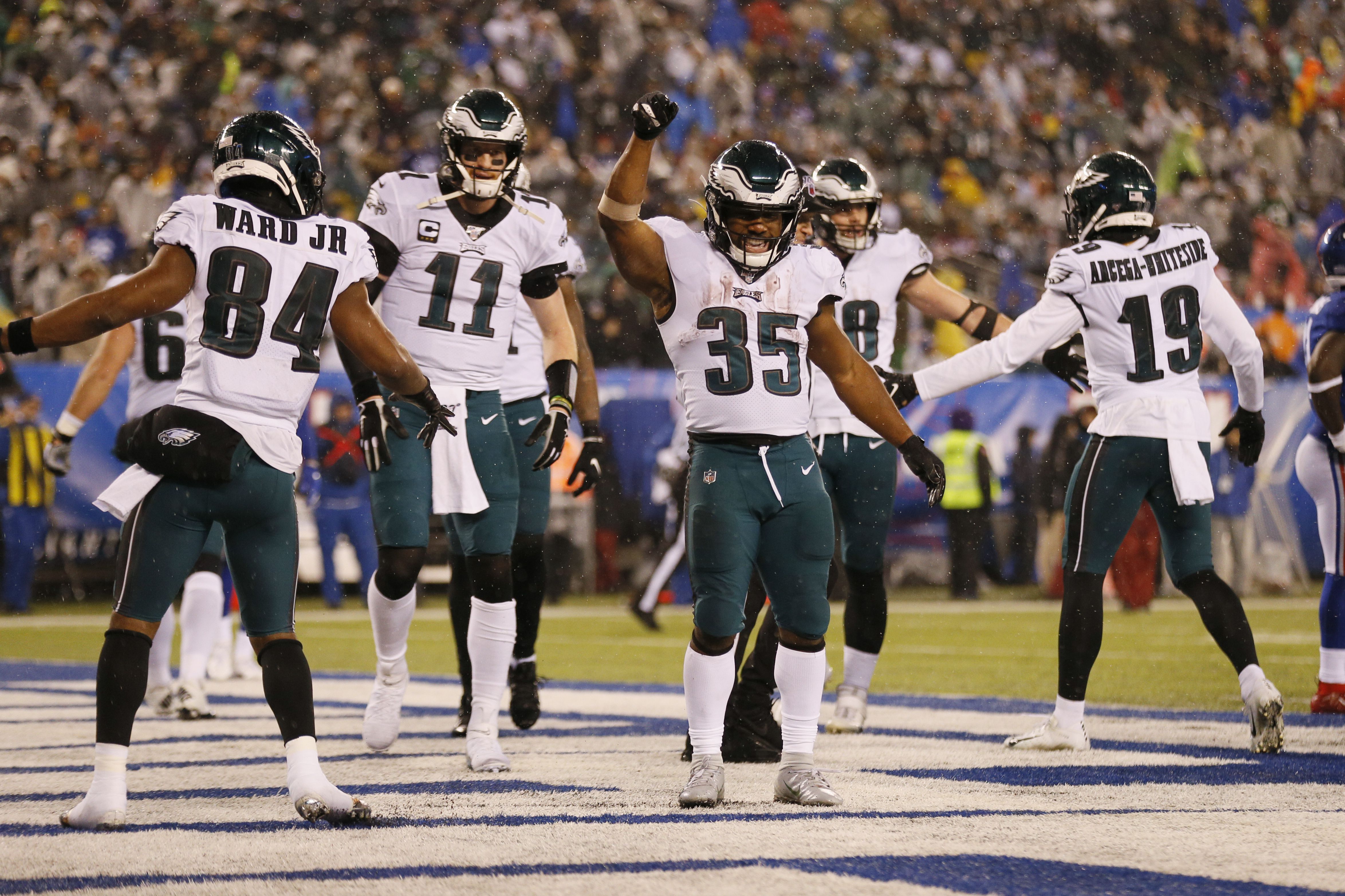 Philadelphia Eagles running back Boston Scott (49) warms up before