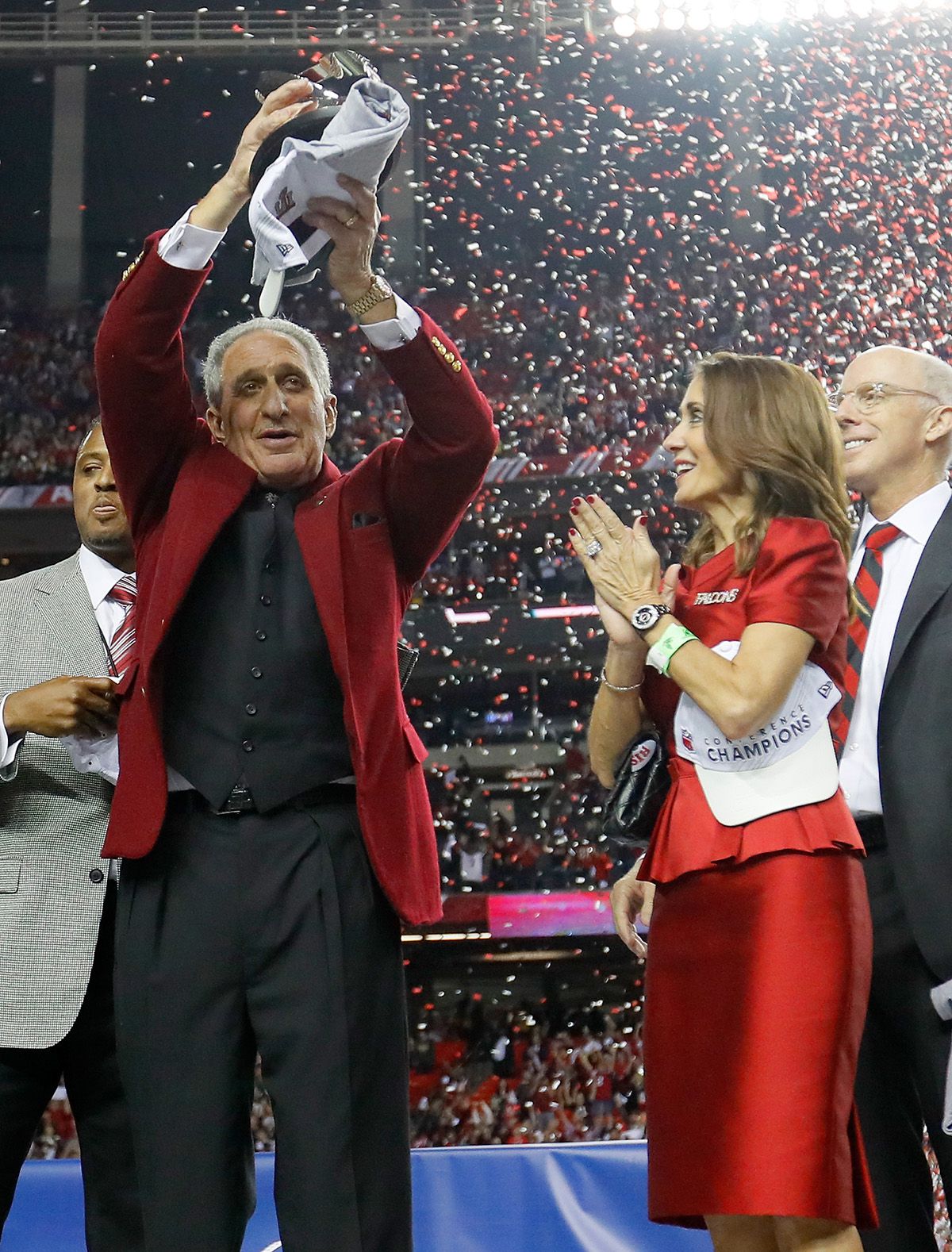 Atlanta Falcons owner Arthur Blank (L) dances with players after defeating  the Green Bay Packers 44-21 to win the NFC Championship game at the Georgia  Dome on January 22, 2017 in Atlanta.