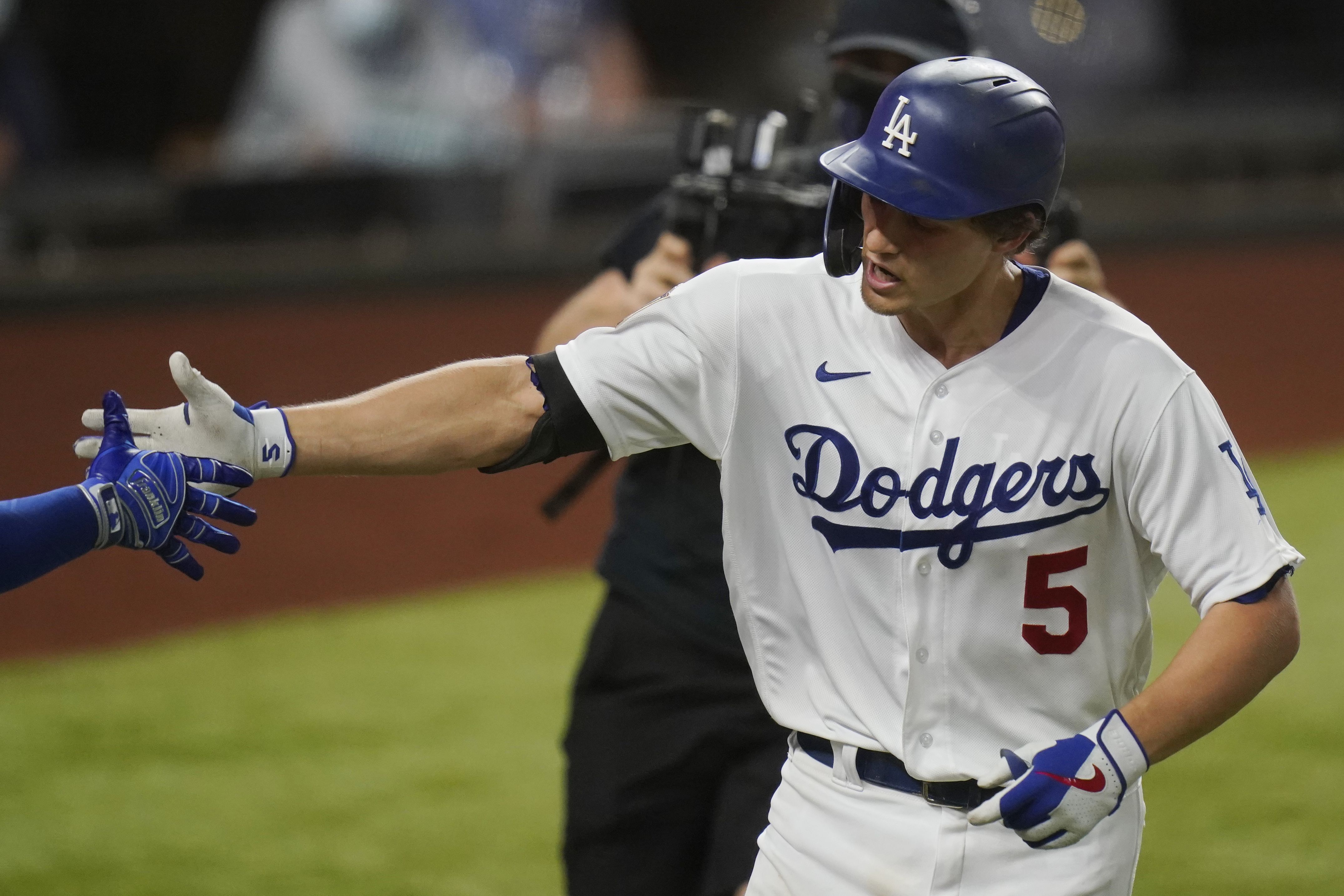 Los Angeles Dodgers' Dustin May takes liner off head during game