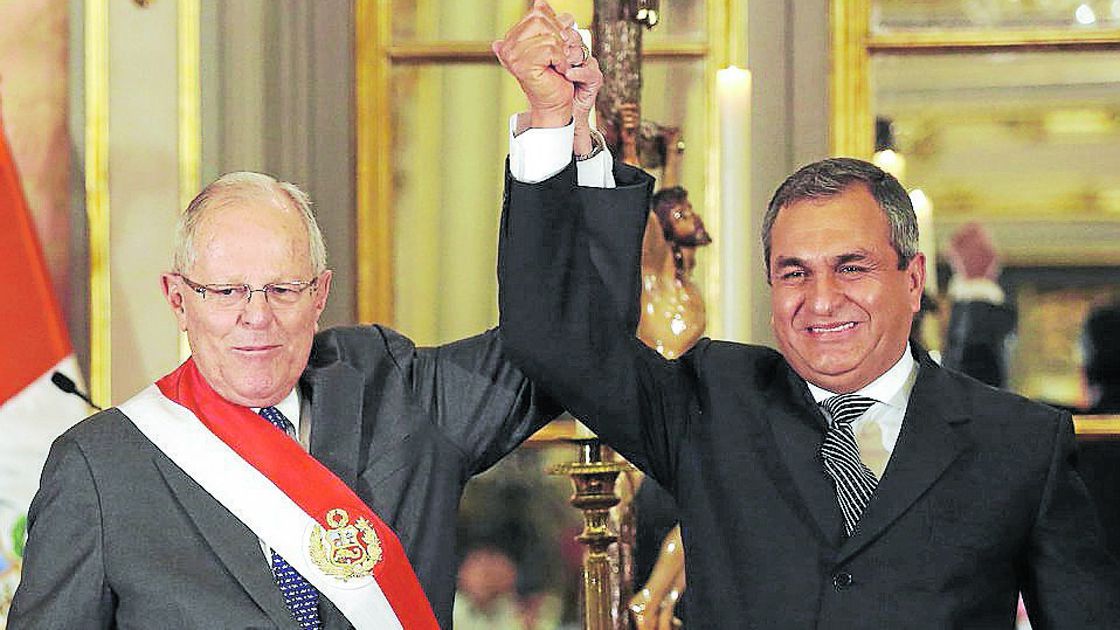 Peru's President Pedro Pablo Kuczynski and new Interior Minister Vicente Romero react during the minister swearing-in ceremony at the government palace in Lima