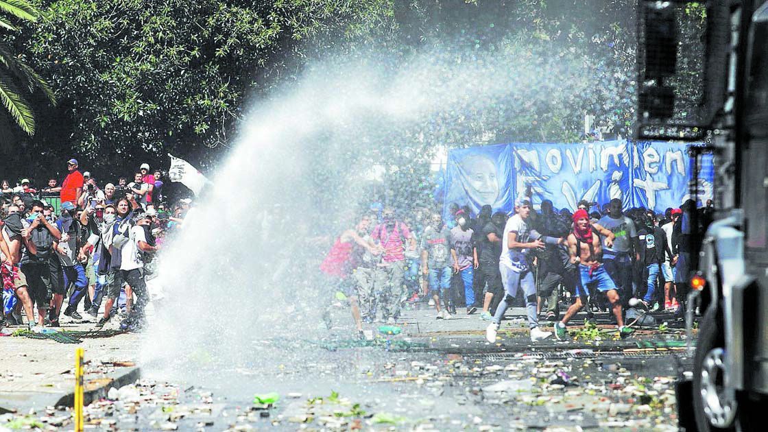 Demonstrators clash with police as lawmakers debate a pension reform measure, in Buenos Aires