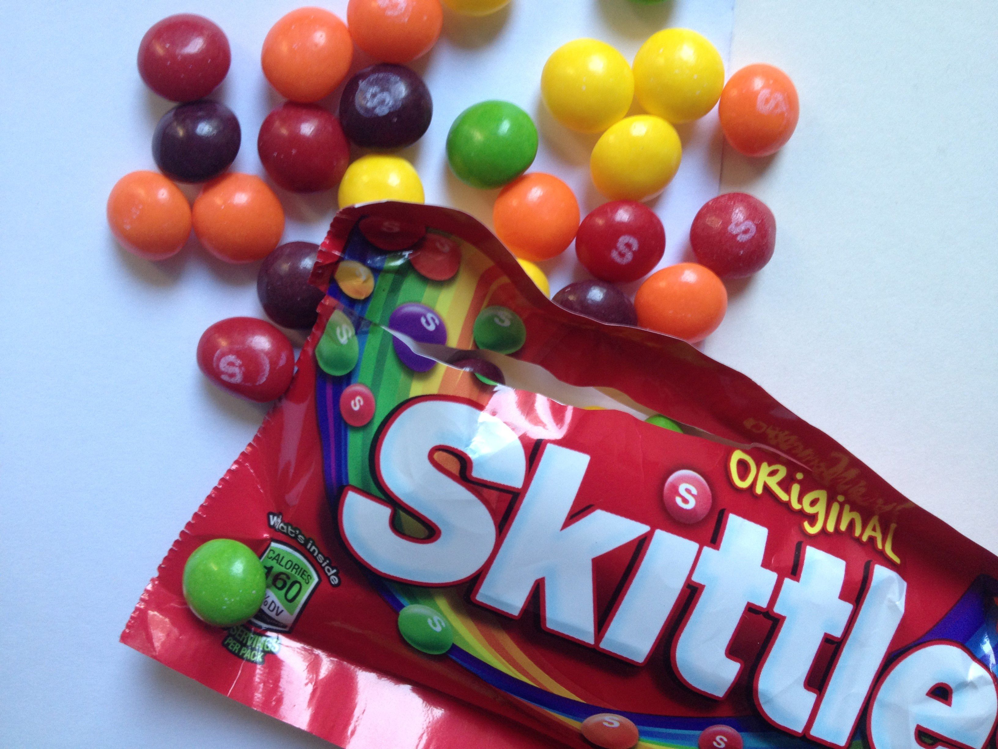 Skittles lose their rainbow and go black and white to celebrate