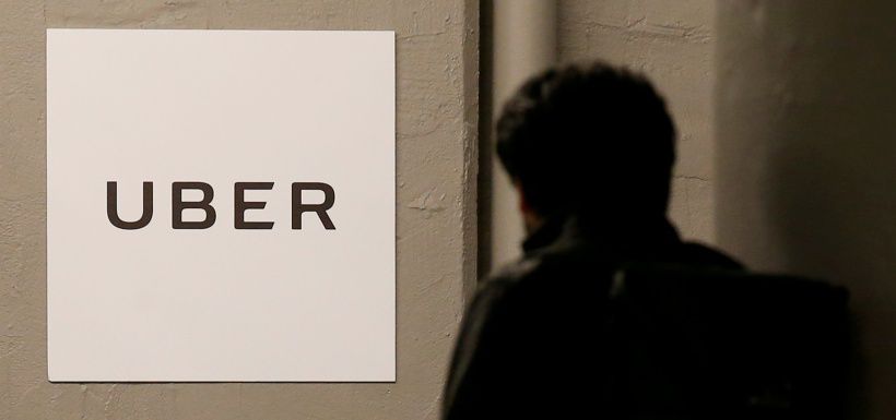 FILE PHOTO -  A man arrives at the Uber offices in Queens, New York