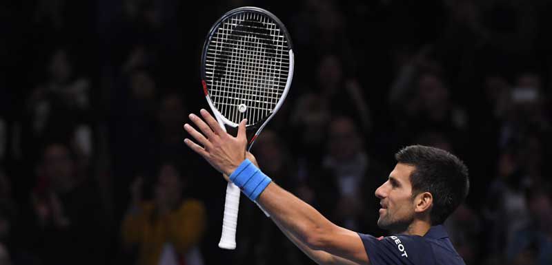 Serbia's Novak Djokovic celebrates winning his semi final match against Japan's Kei Nishikori