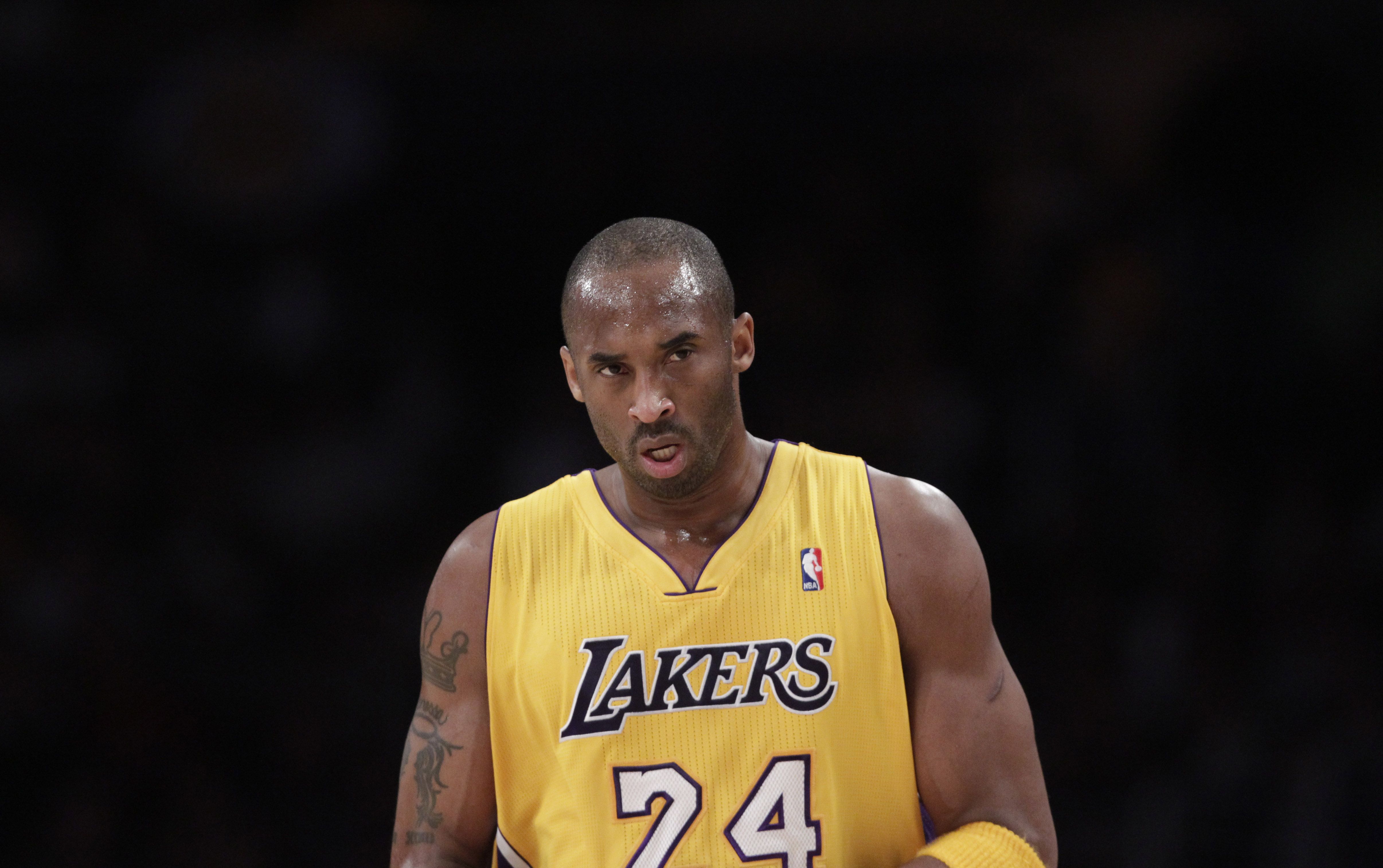 Why did Kobe Bryant wear two jersey numbers?