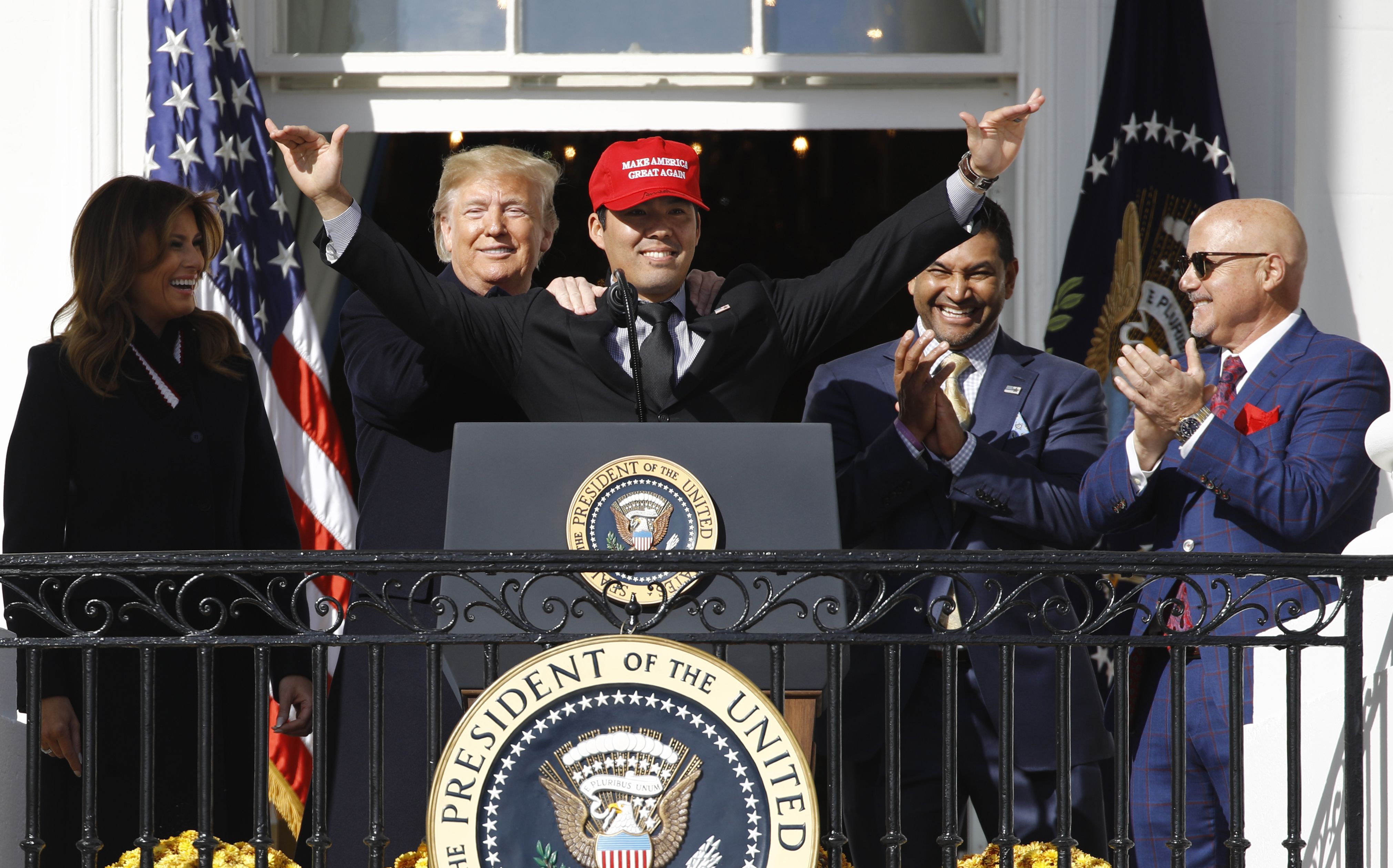 Trump hugs Washington Nationals' Kurt Suzuki, wearing 'MAGA' hat during  White House visit