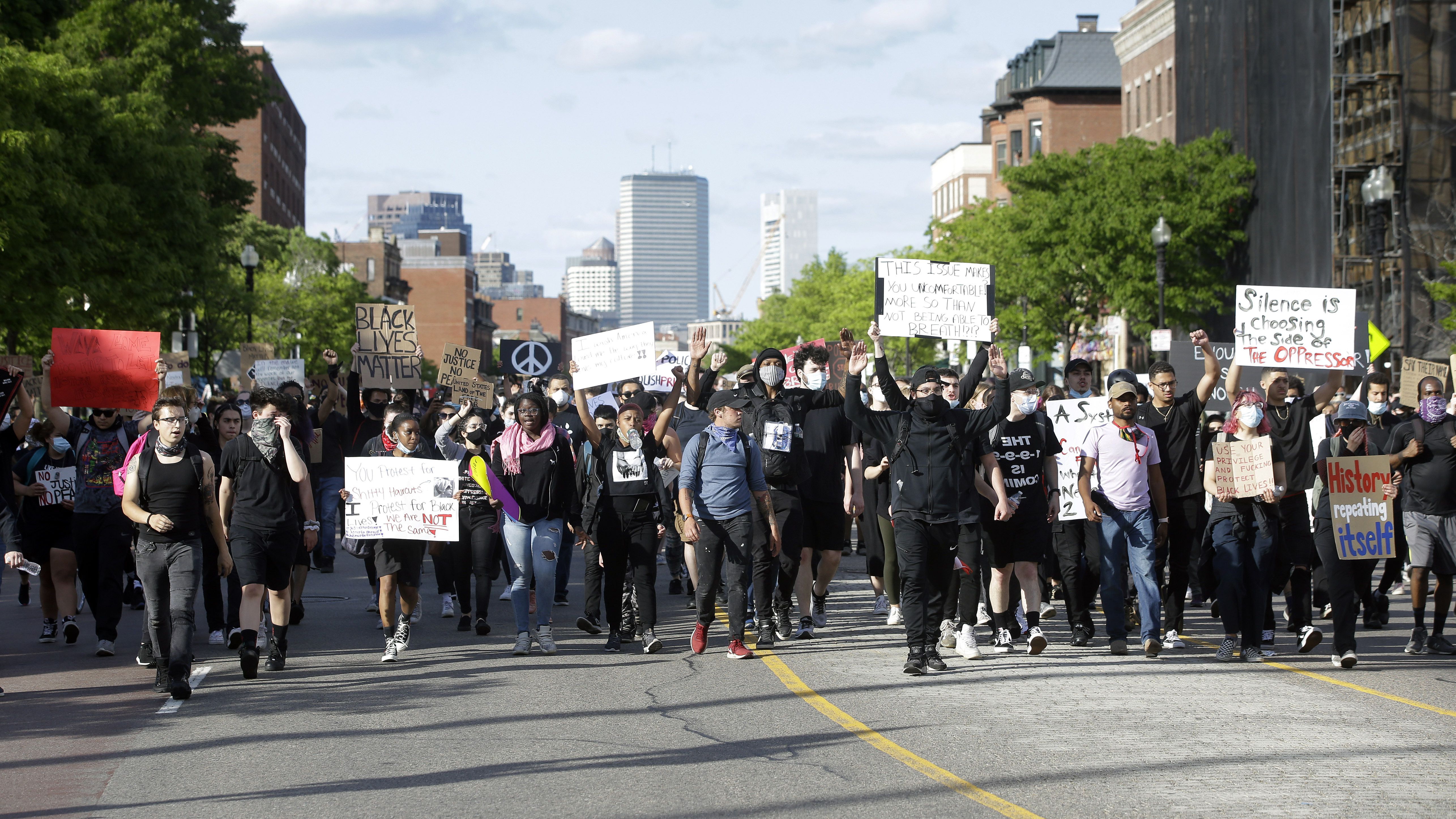 May 31, 2020, Boston, Massachusetts, USA: A looter inside Louis Vuitton  inside Copley Place in Boston. Many stores in downtown Boston were looted  following a rally against the death of George in