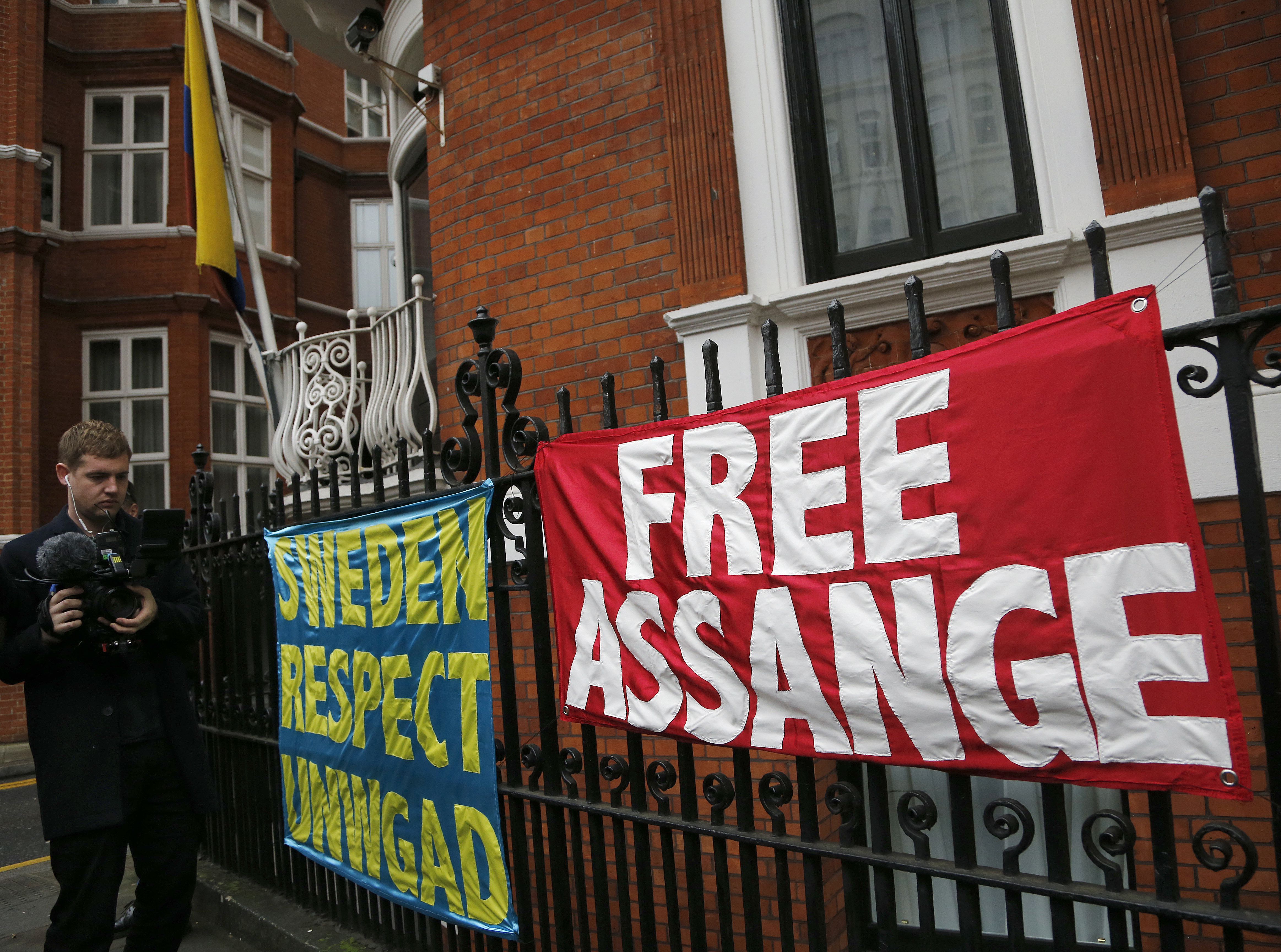 Banners outside the Ecuadorian embassy in London, Monday, Nov.