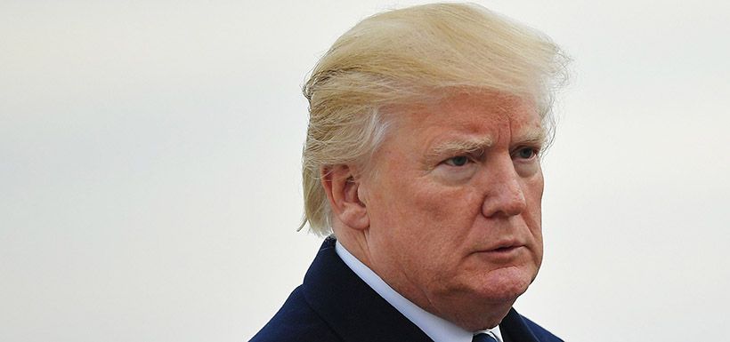 US President Donald Trump makes his way to board Air Force One before