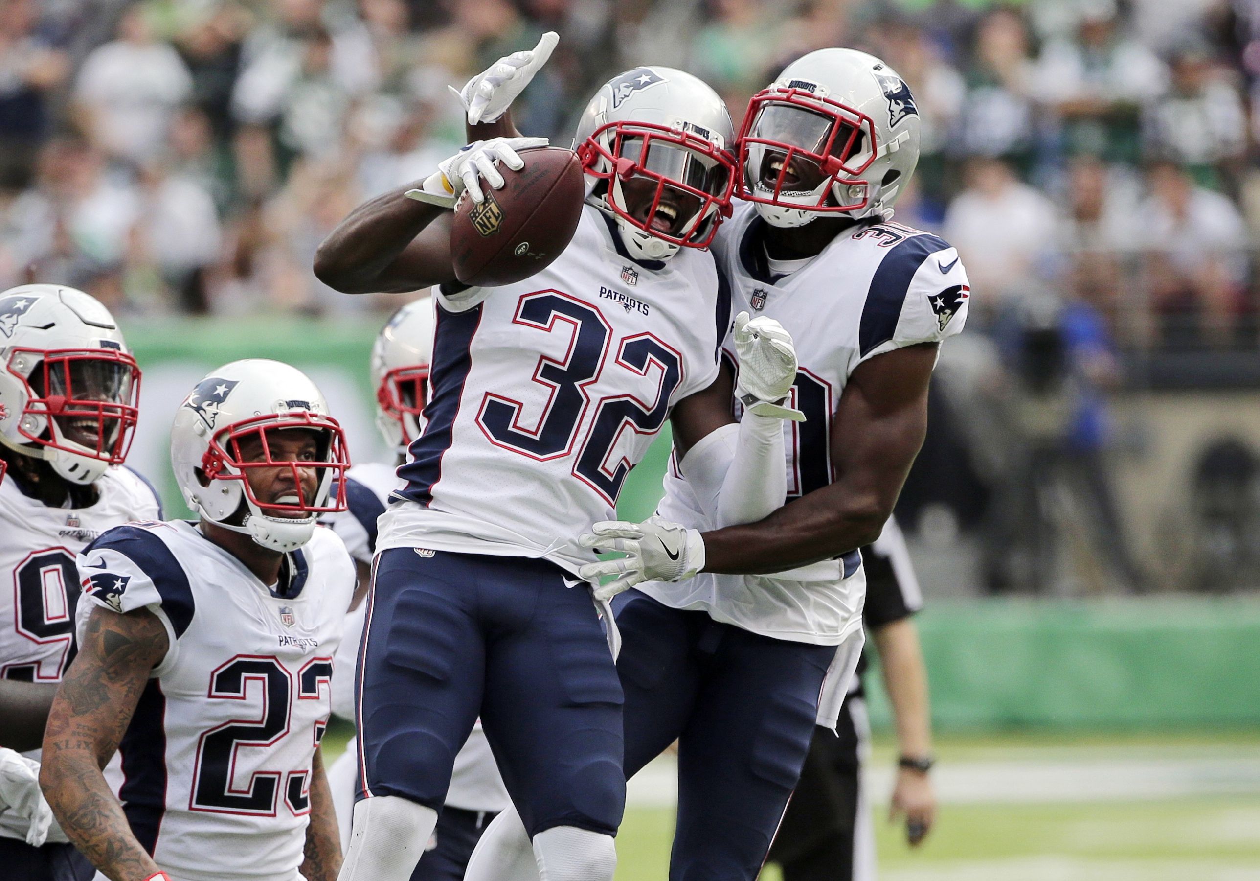 New England Patriots free safety Devin McCourty (32) celebrates with New  England Patriots defen …