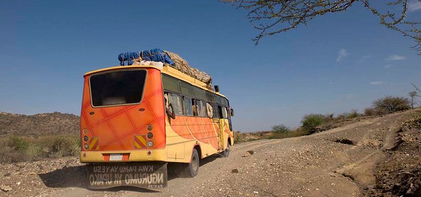 bus-on-dirt-road-tanzania-africa-e1450740843257