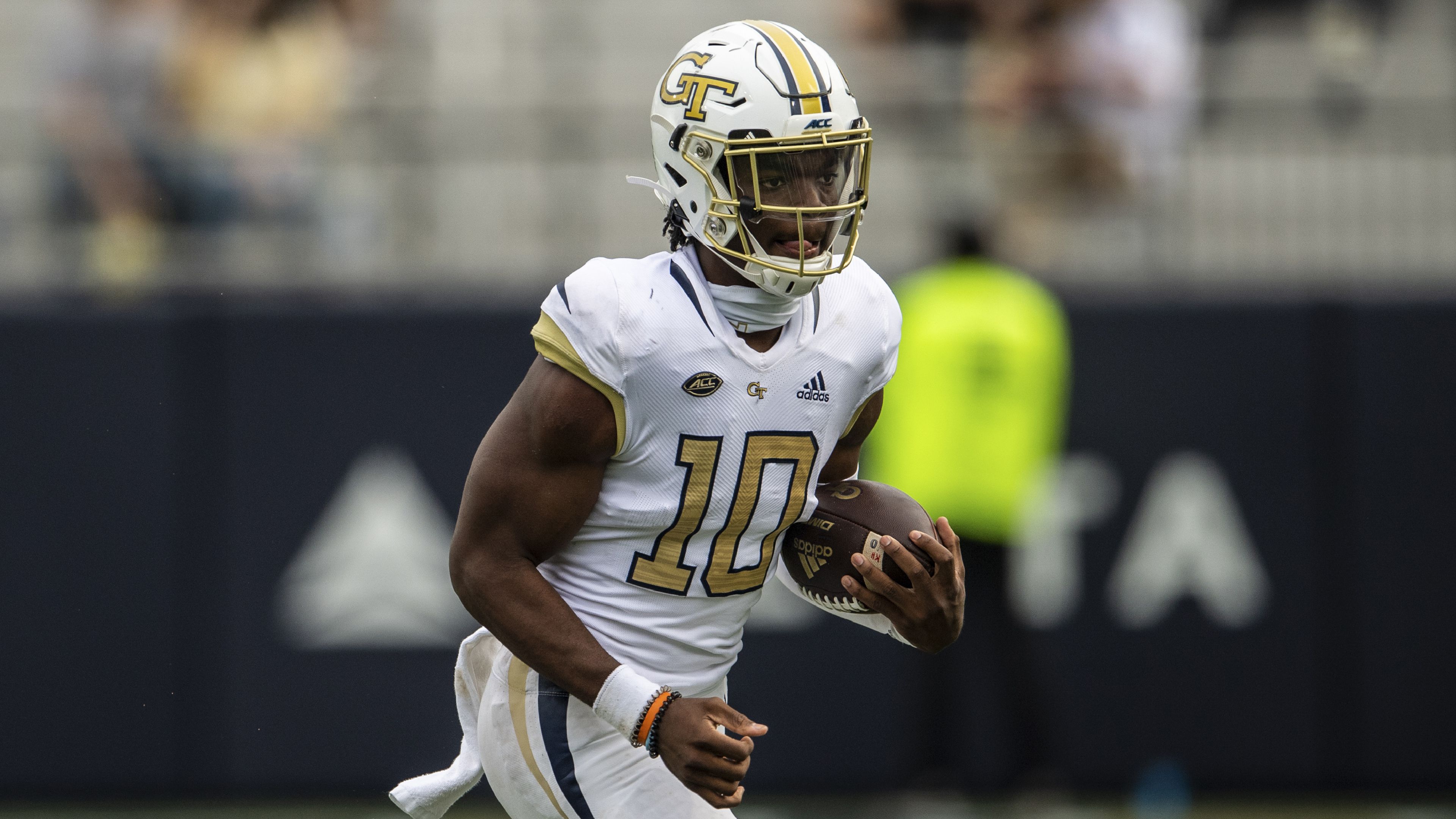 Louisville running back Javian Hawkins (10) runs from the pursuit