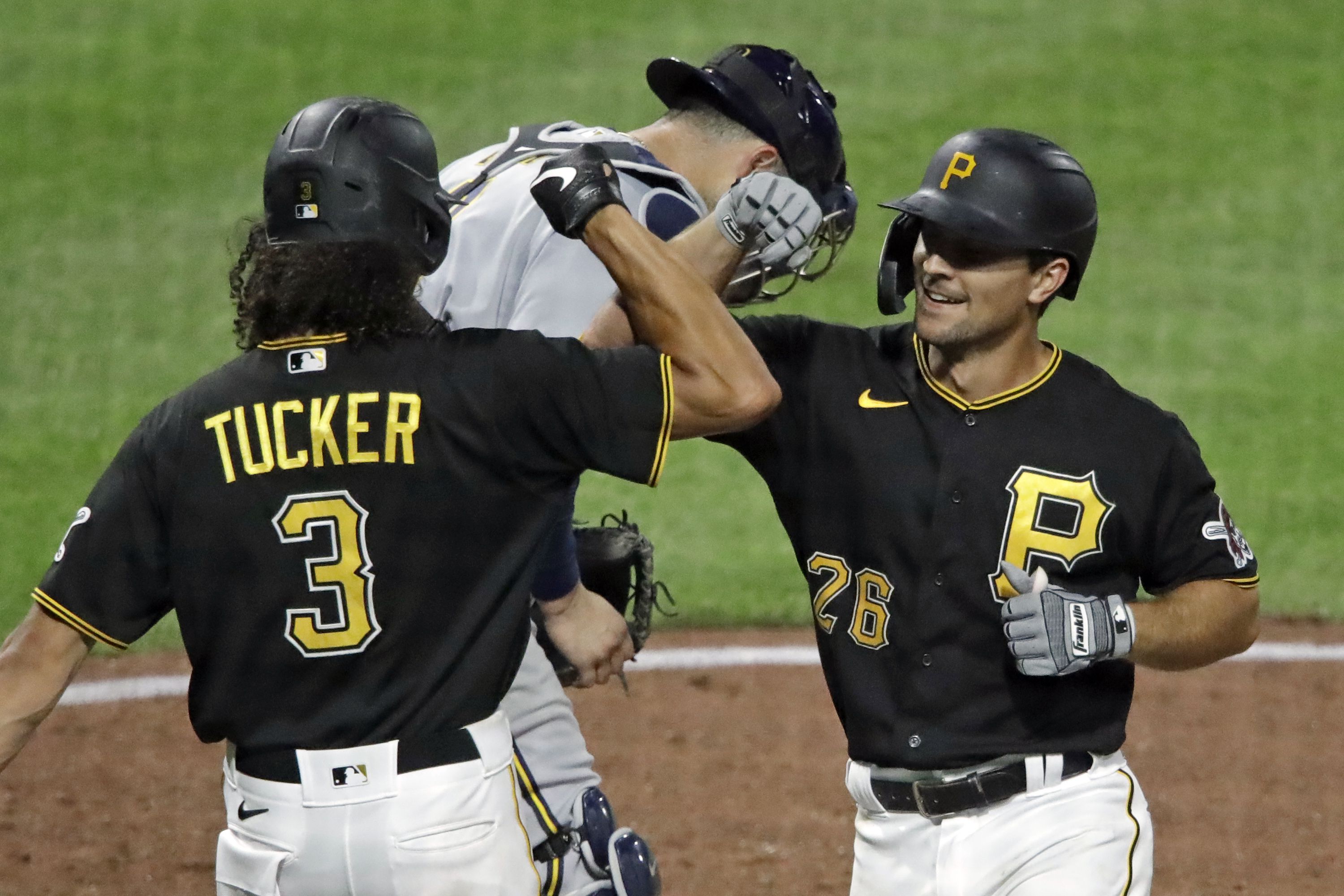 Pittsburgh Pirates relief pitcher Clay Holmes right, talks with