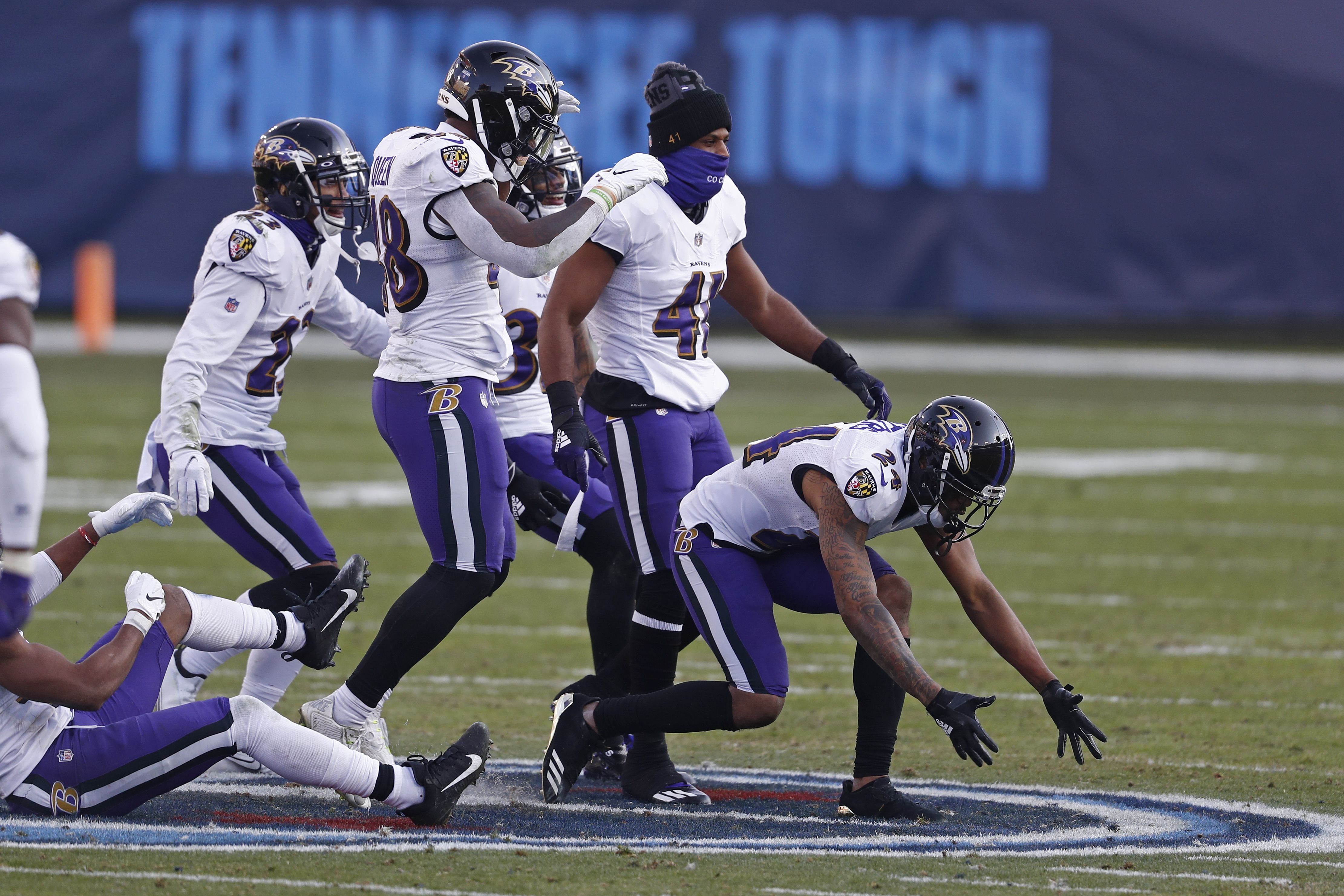 Ravens celebrate on Titans logo, get flagged for taunting after Marcus  Peters' late interception