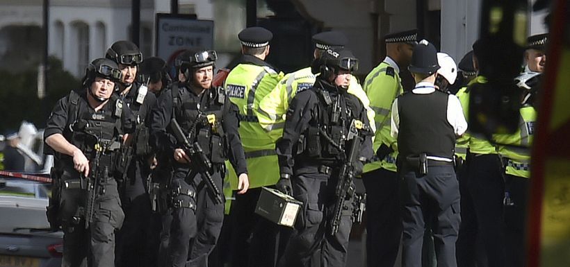 Armed police close to Parsons Green station in west London after an e