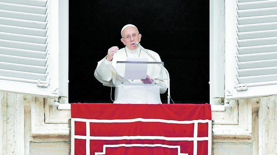 Pope Francis gestures as he speaks during the Angelus prayer in Saint