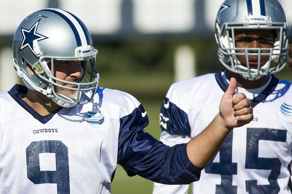 Dallas Cowboys' quarterback Tony Romo (R) is seen next to backup