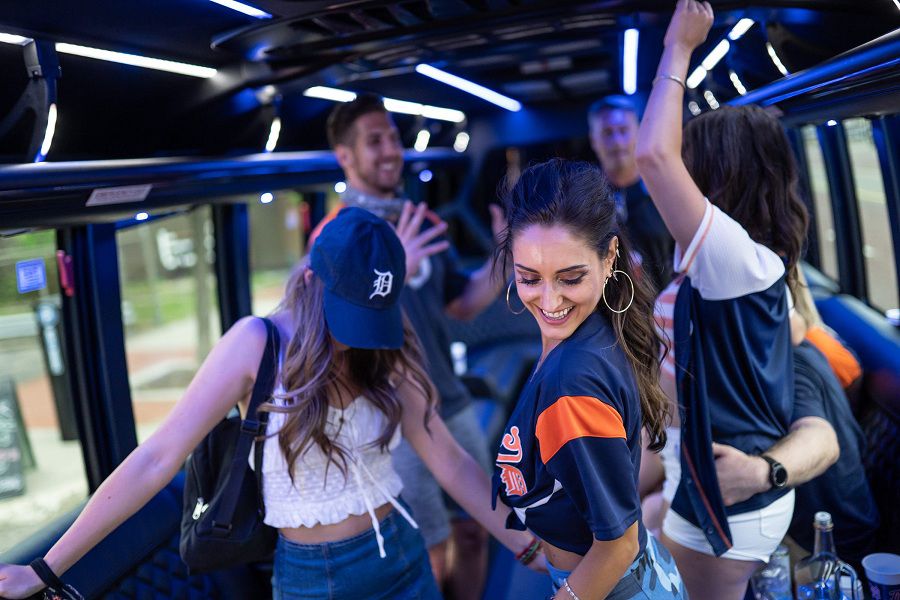 Jenna Przeslawski (center) of Detroit dances with Destiny Drift (left) of Detroit and Kayla Arellano of Detroit while on a party